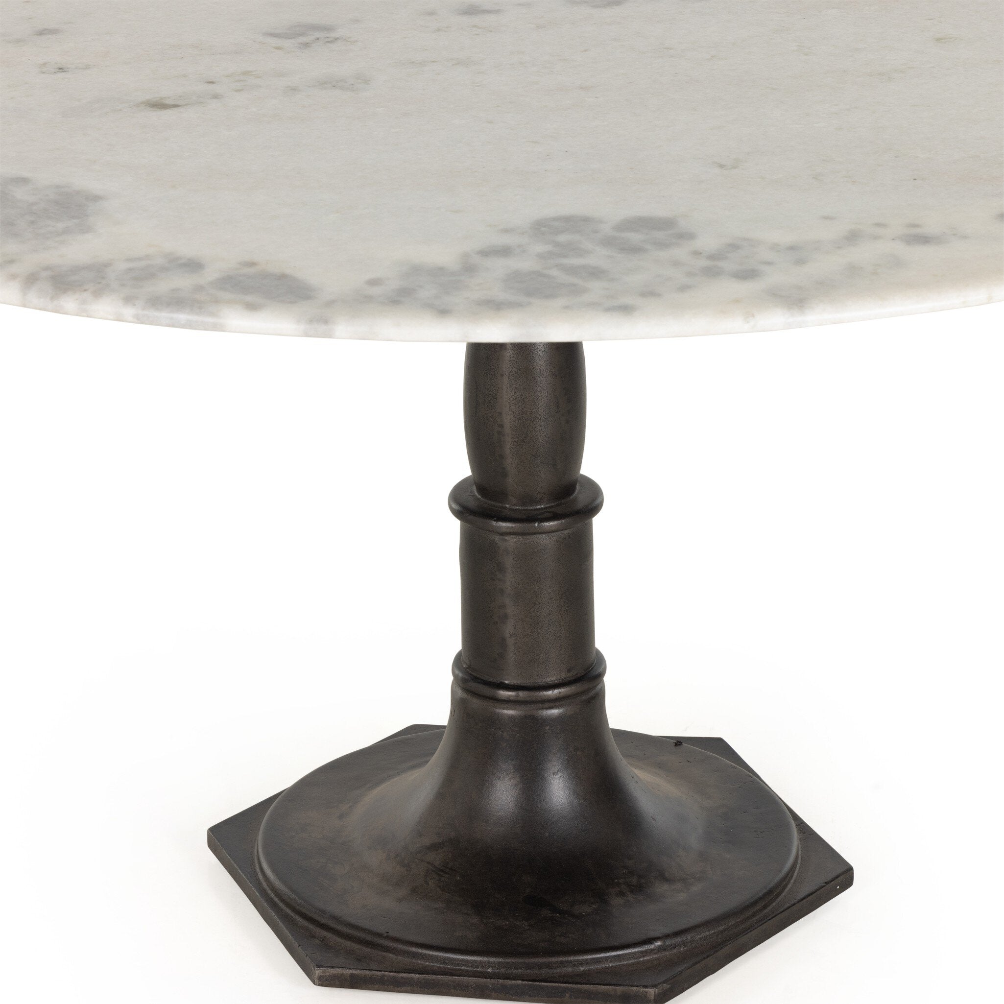 Round marble table with a black metal pedestal base on a white background.