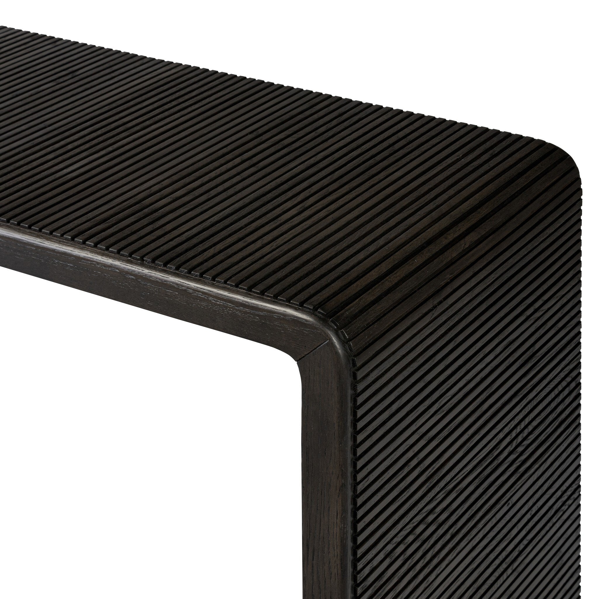 Smoked black oak console table with reeding and rounded edges on a white background.