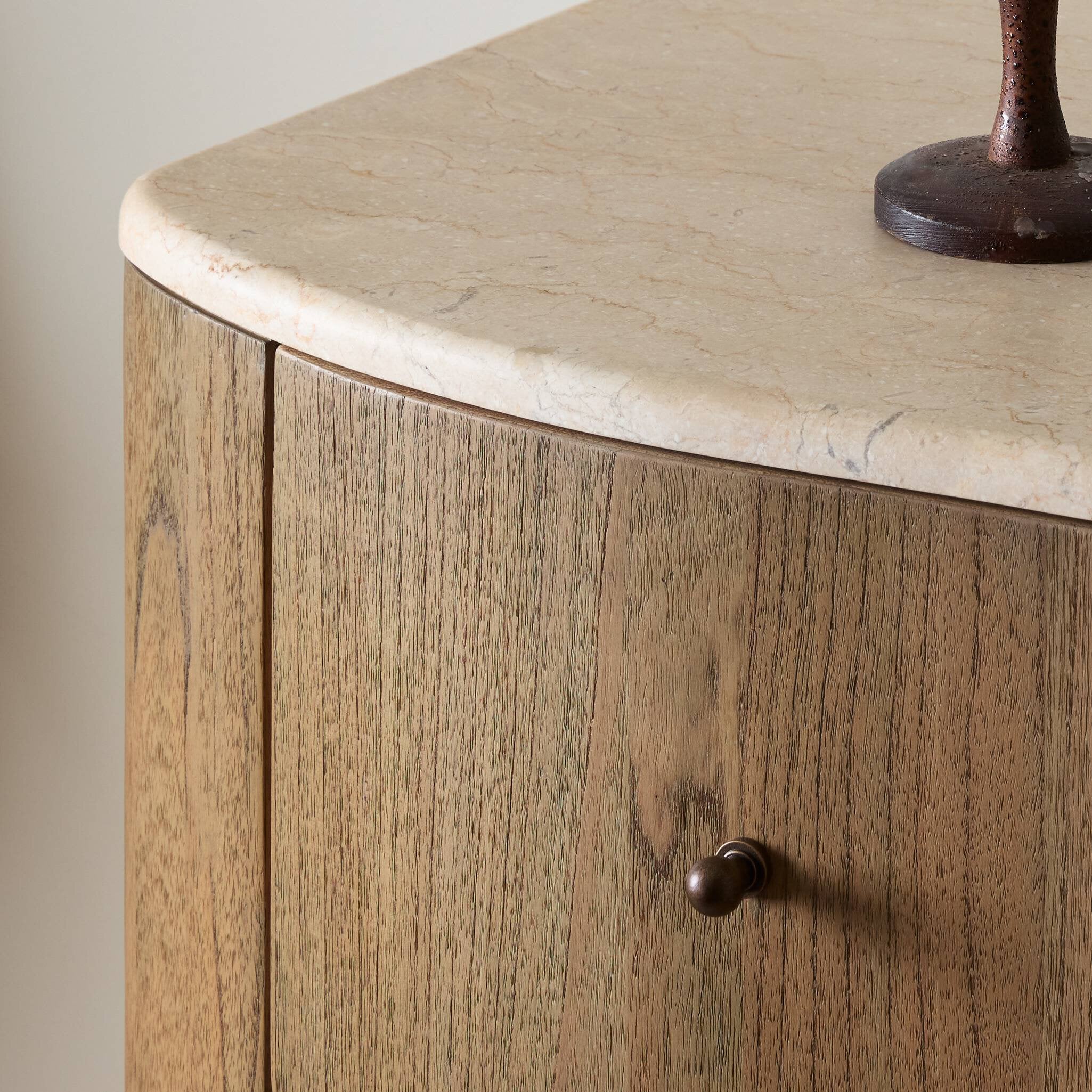 Wooden cabinet with marble countertop and decorative item