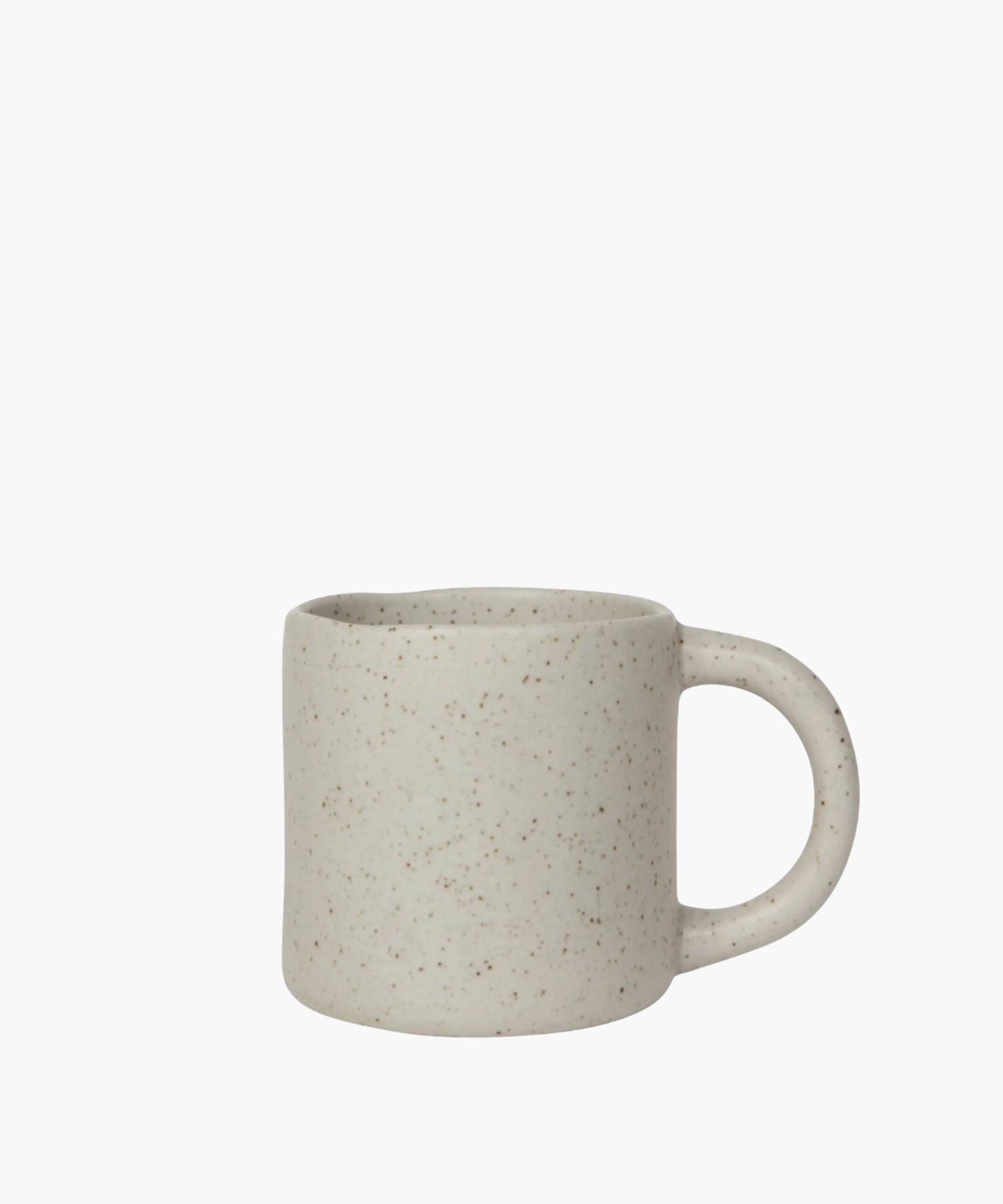 A speckled beige ceramic mug with a smooth surface and a curved handle. The mug has a rustic, minimalist design, evoking a cozy and comforting feel.