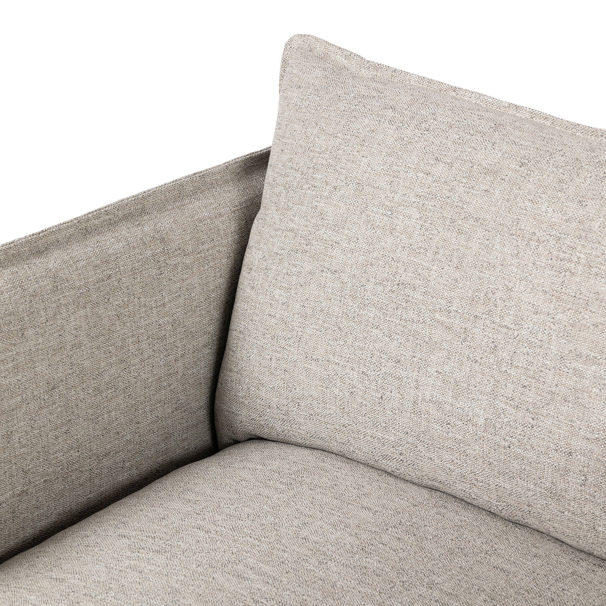 Close up of a neutral gray outdoor swivel armchair with a pillow on a white background.
