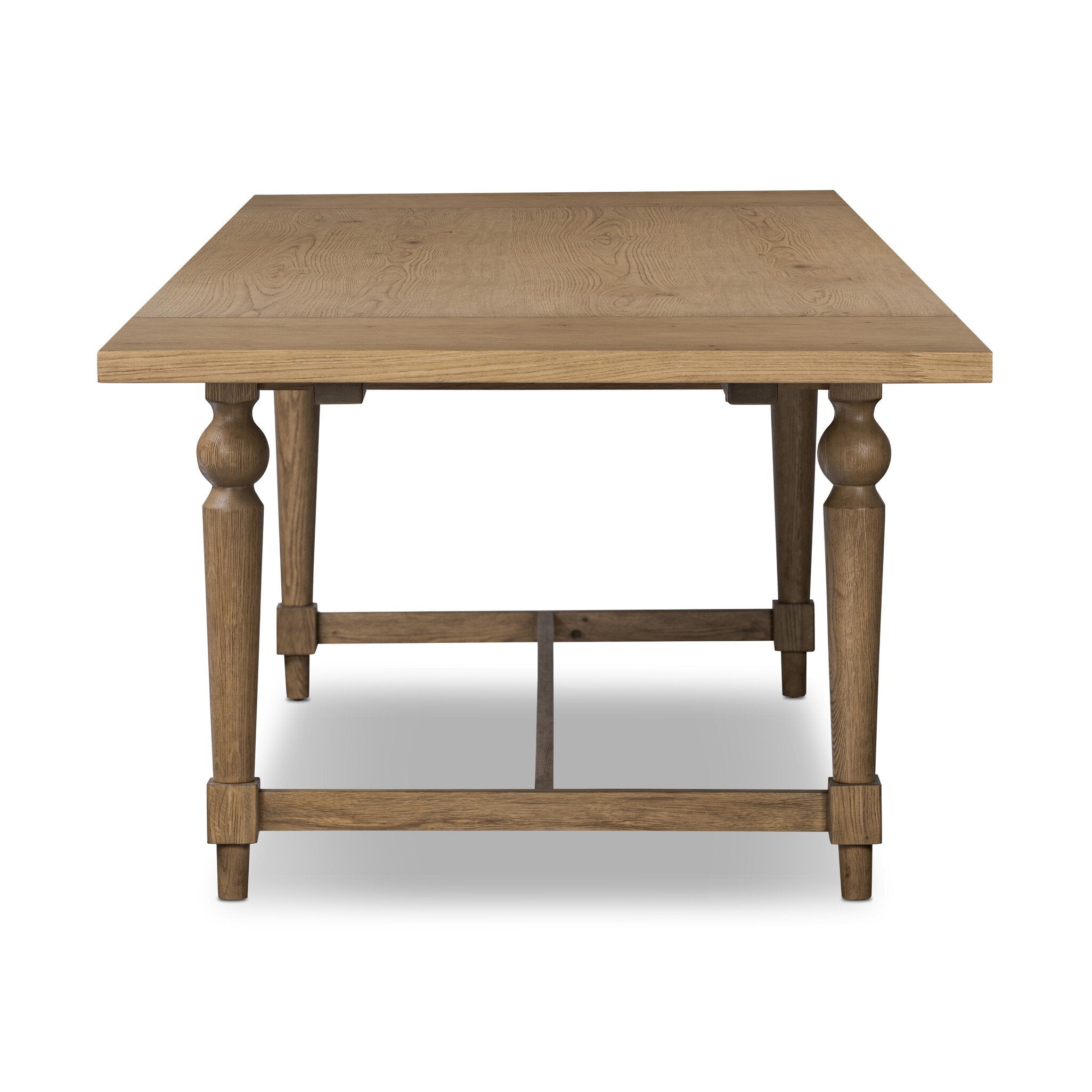 Front view of a rectangular wood dining table on a white background.