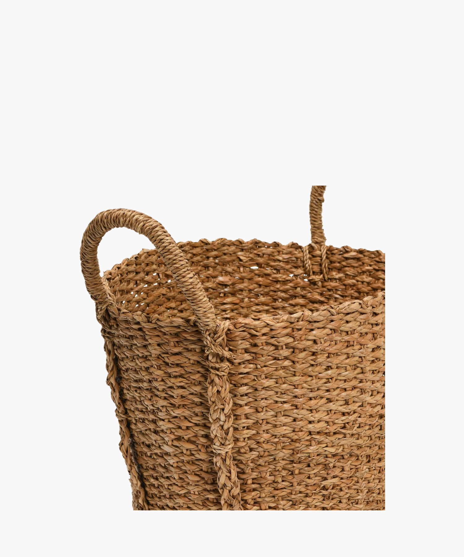 A detailed picture of a hand woven basket highlighting its two sturdy looped handles and braided texture.