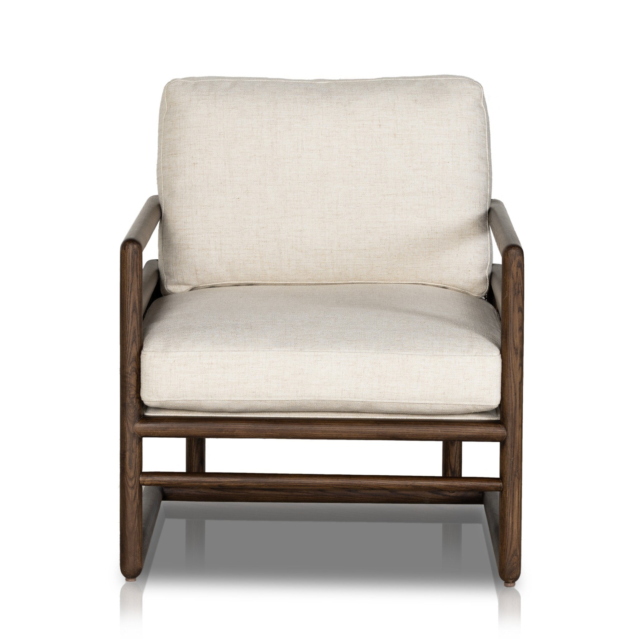 Chair with neutral linen fabric, cane panels with open rounded framing.