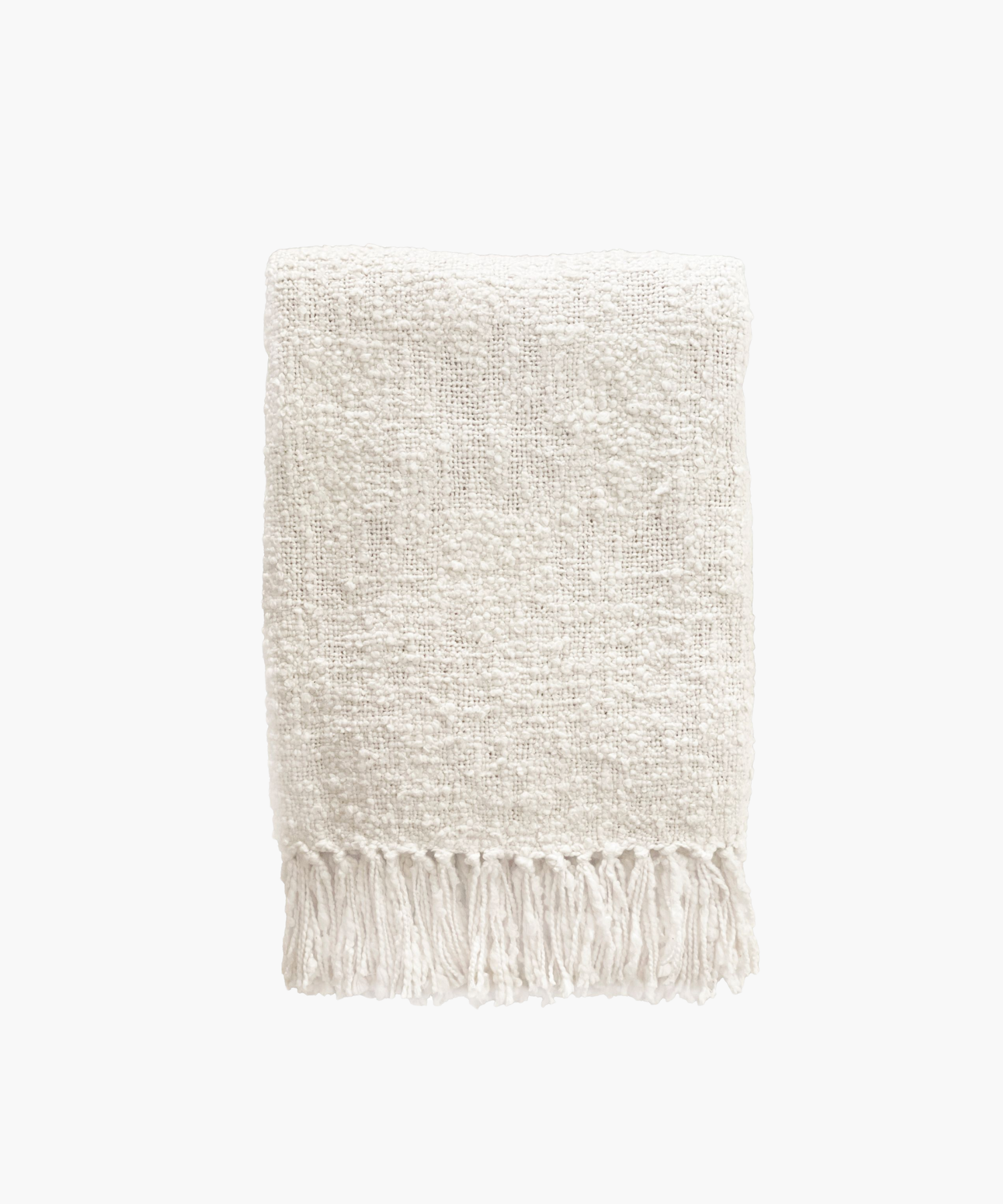 A soft, ivory colored woven throw blanket with a textured pattern and fringed edges, conveying a cozy and inviting feel.