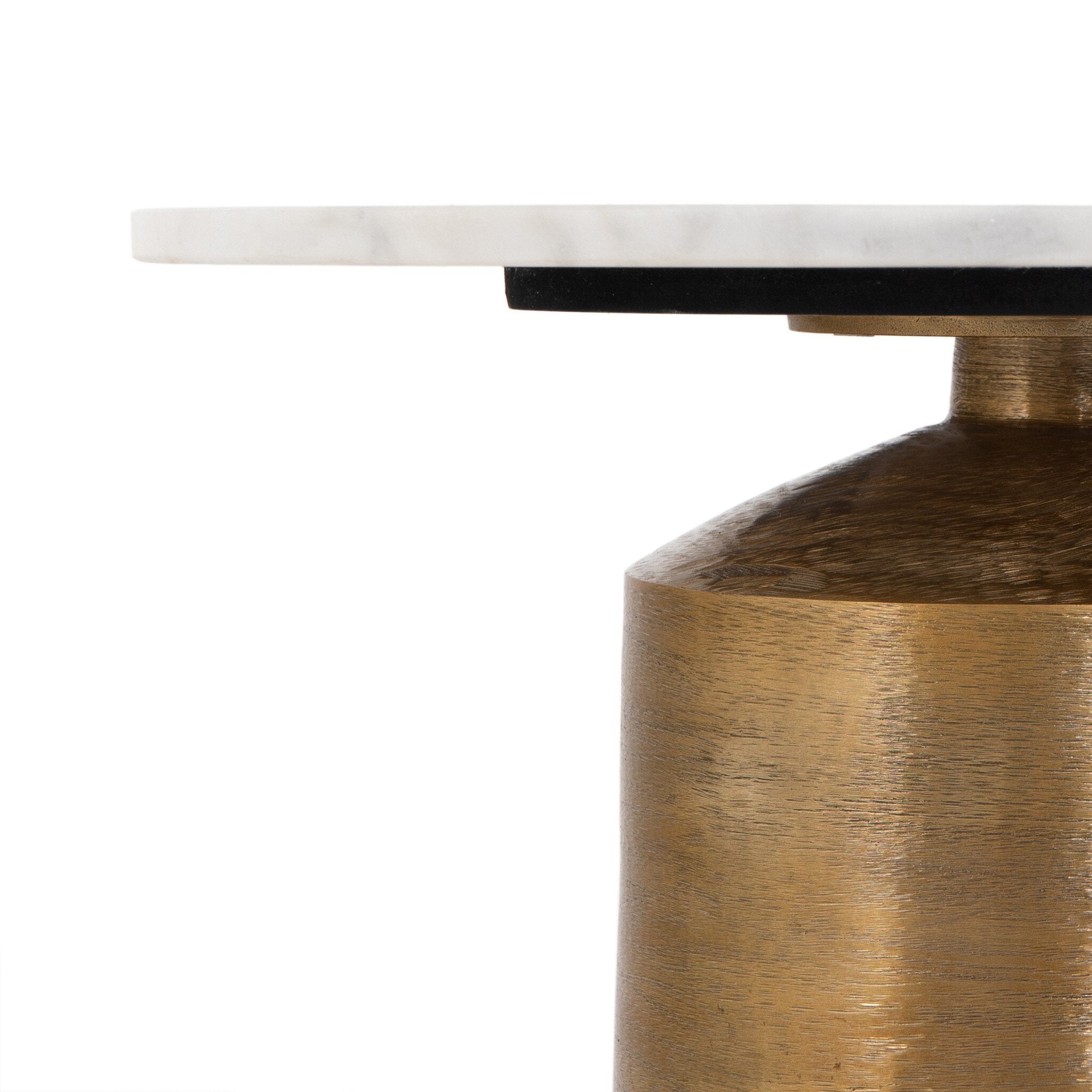 Close-up of a table with a marble top and brass base on a white background.