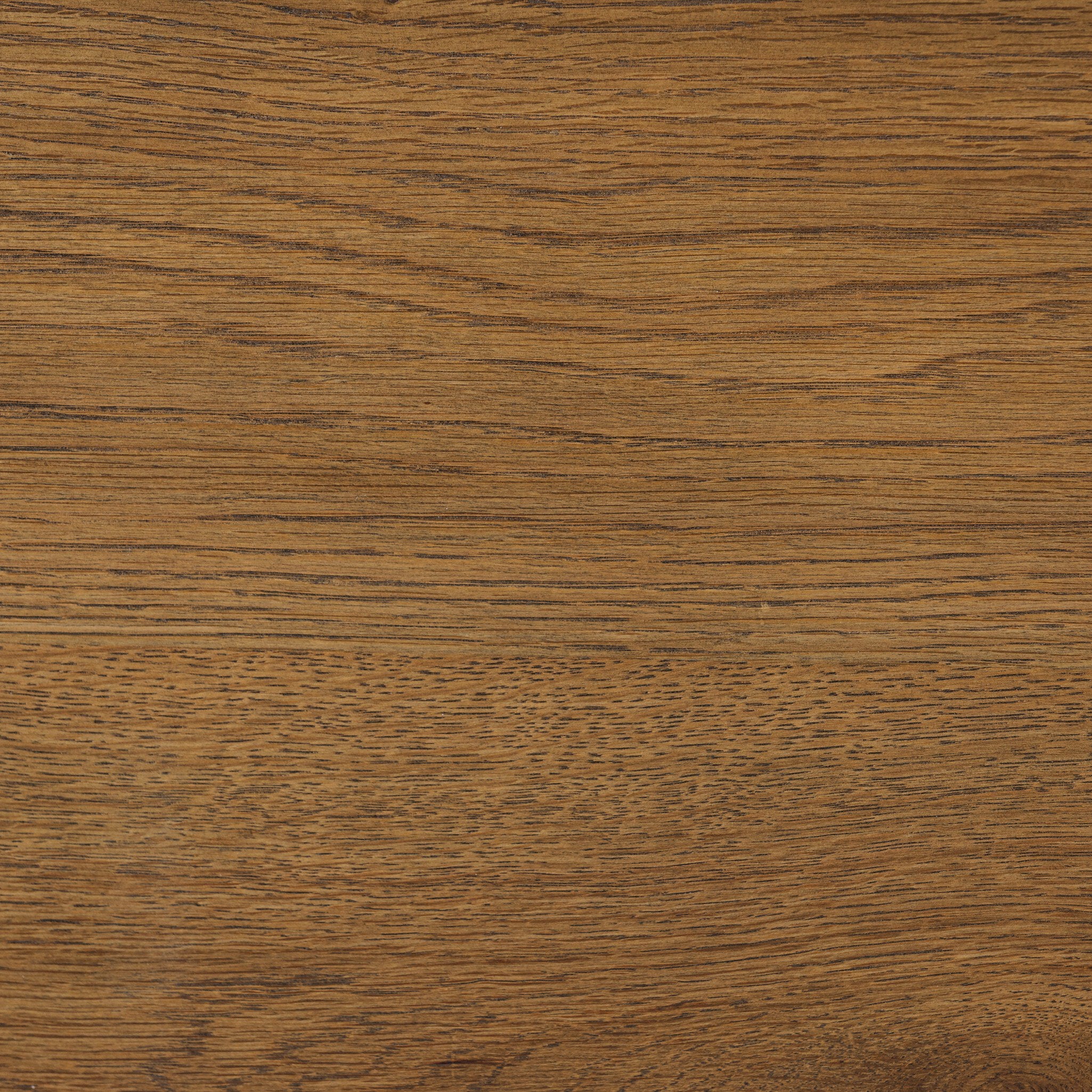 Close up of a heritage-inspired oak bed featuring soft curves, linen upholstered headboard, and white bedding on a white background.