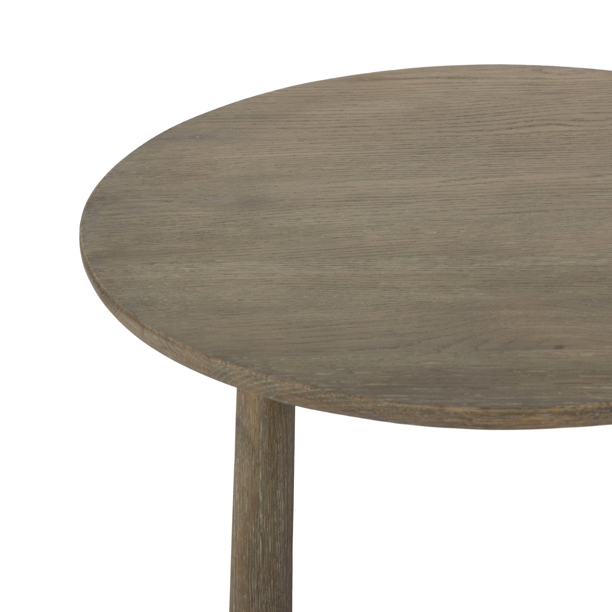 Simple oak round side table on a white background.