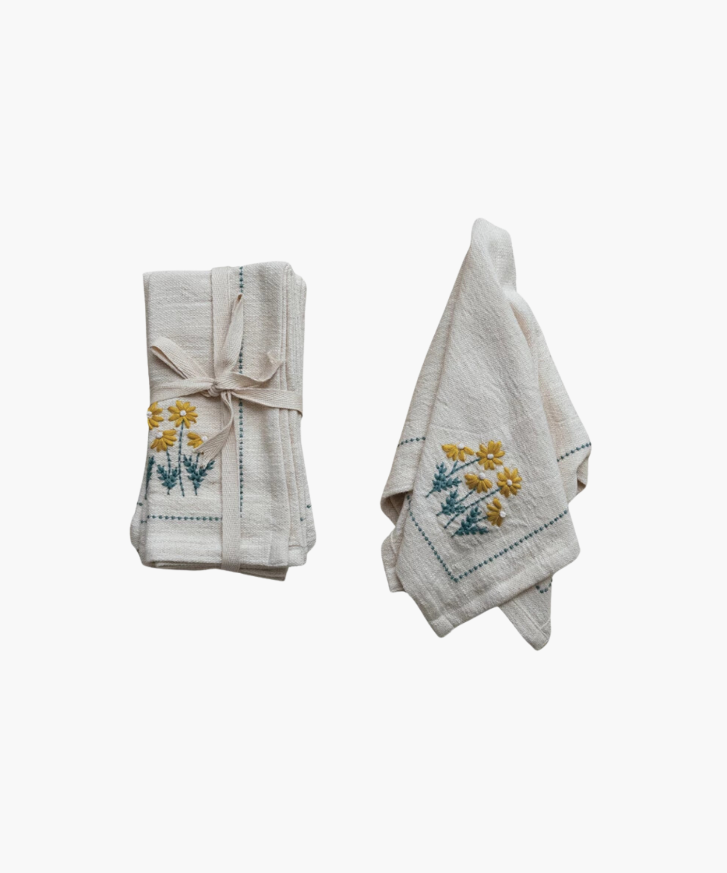 Floral Napkin styled as a set of four and individually showing its neutral color and embroidered floral print.