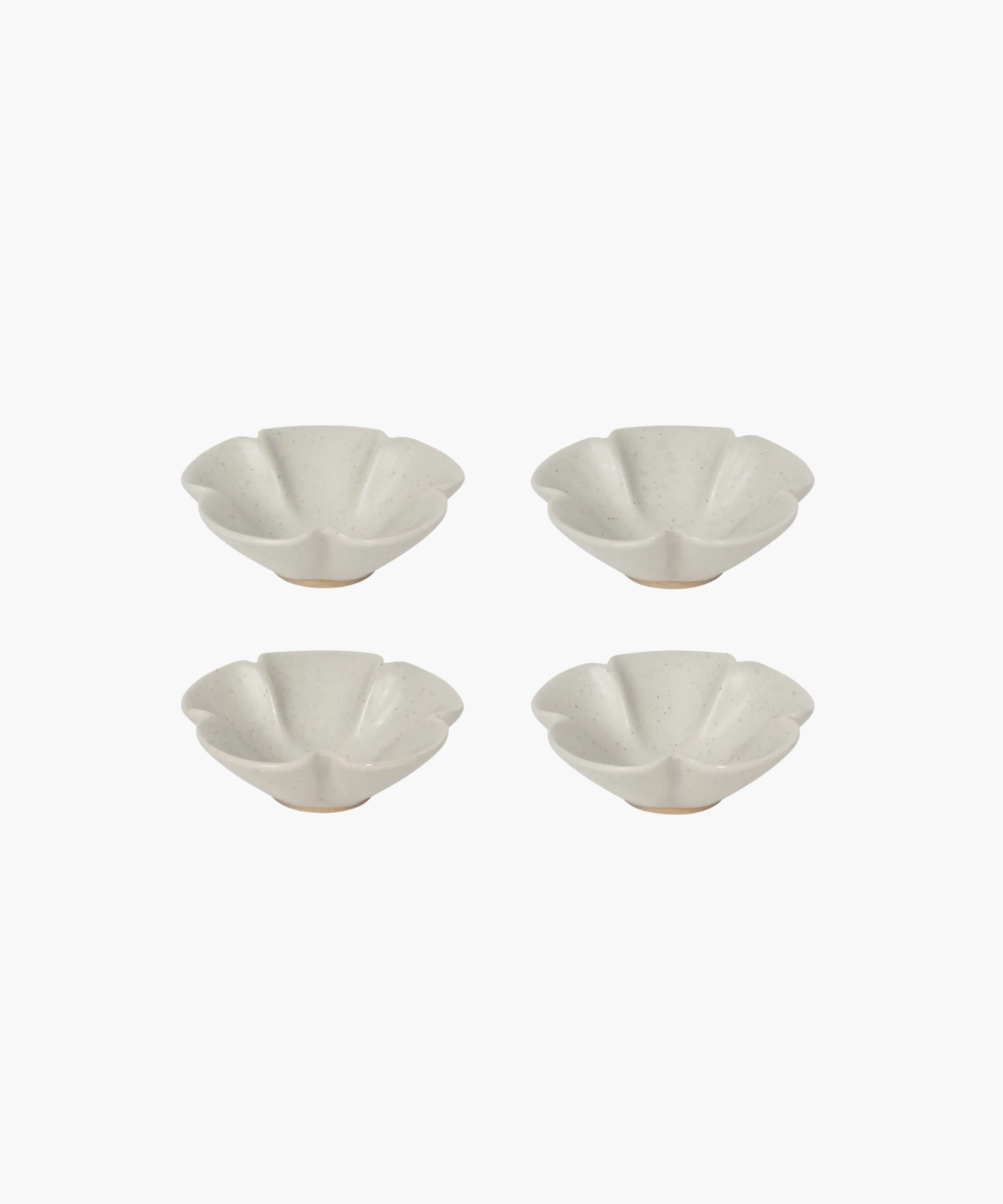 Four white, flower-shaped ceramic bowls with speckled texture are arranged in a symmetrical grid on a plain white background.