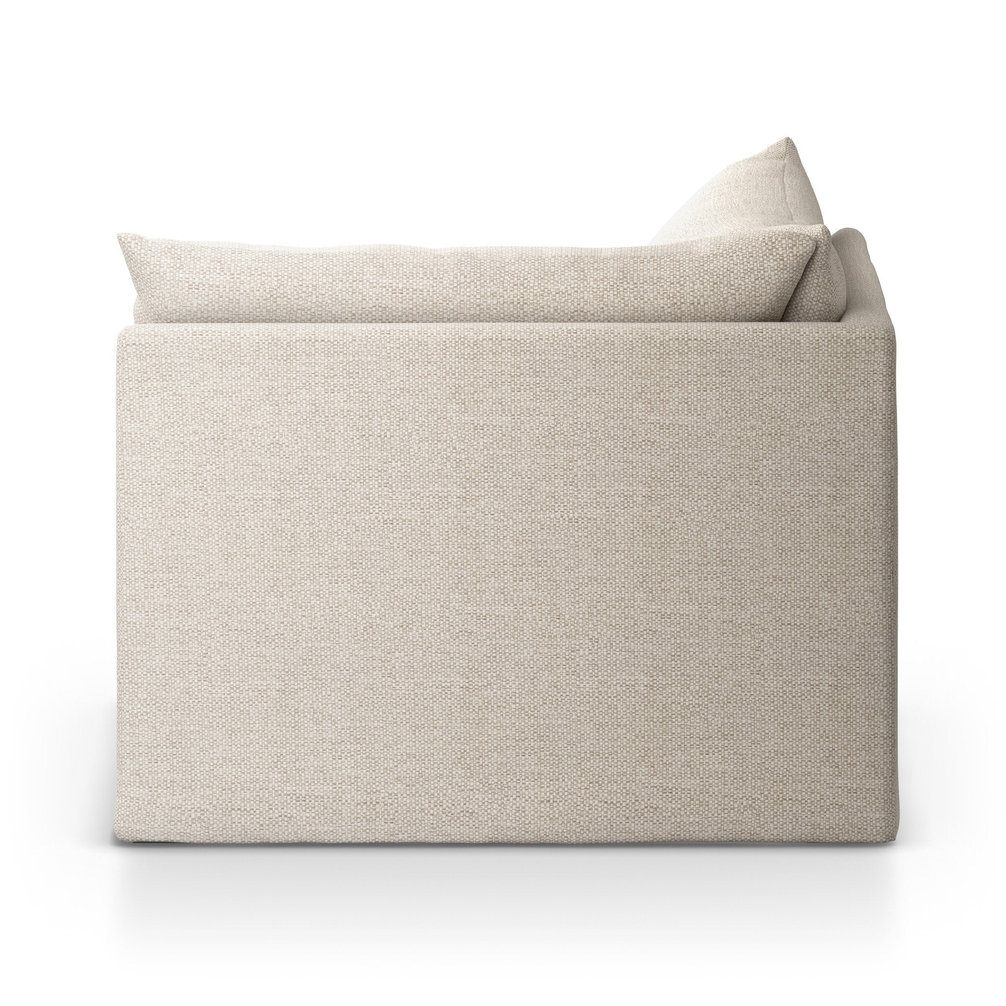 The back of the corner section of a beige slipcover outdoor sofa on a white background.
