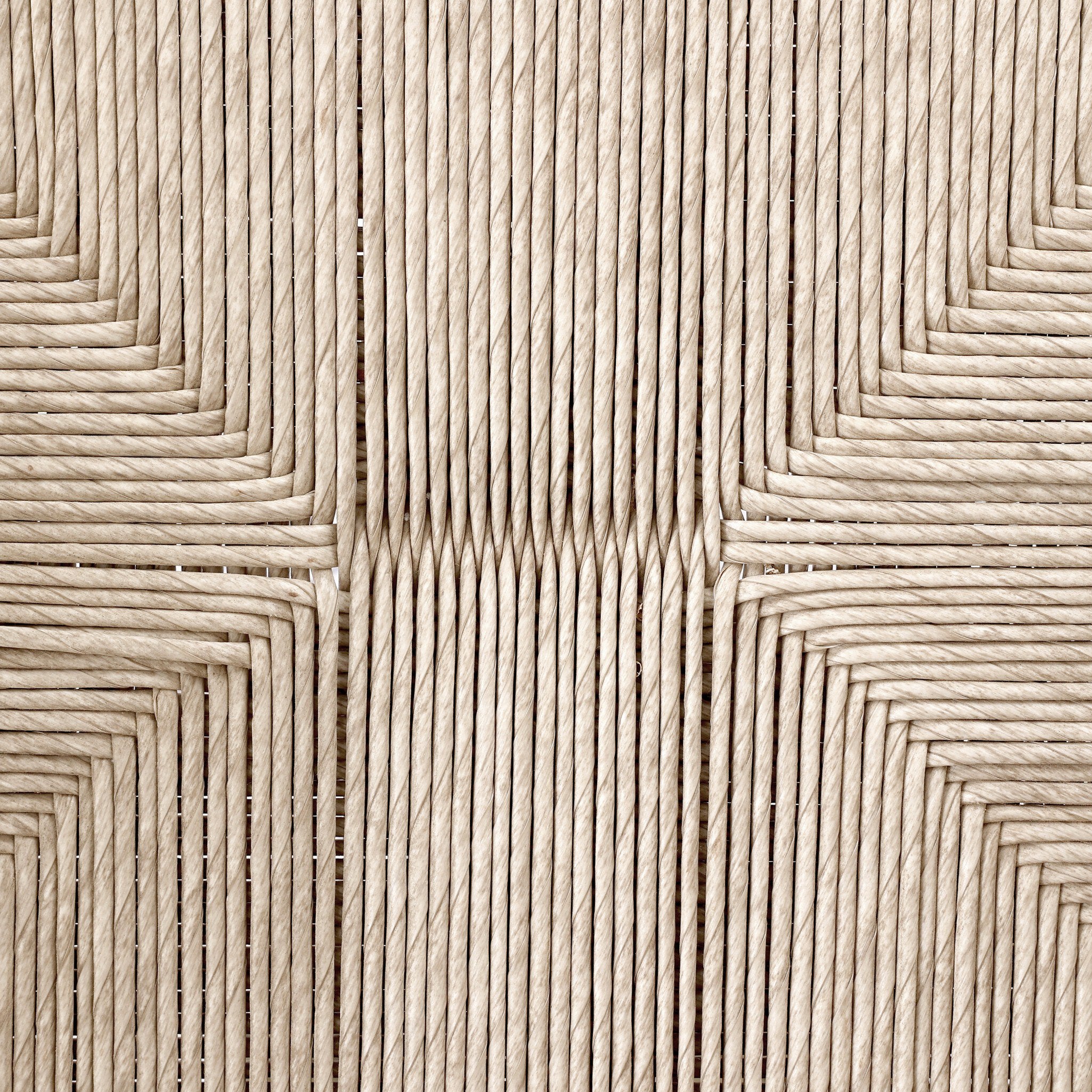 Close up of the woven pattern from the seat of the outdoor dining armchair.