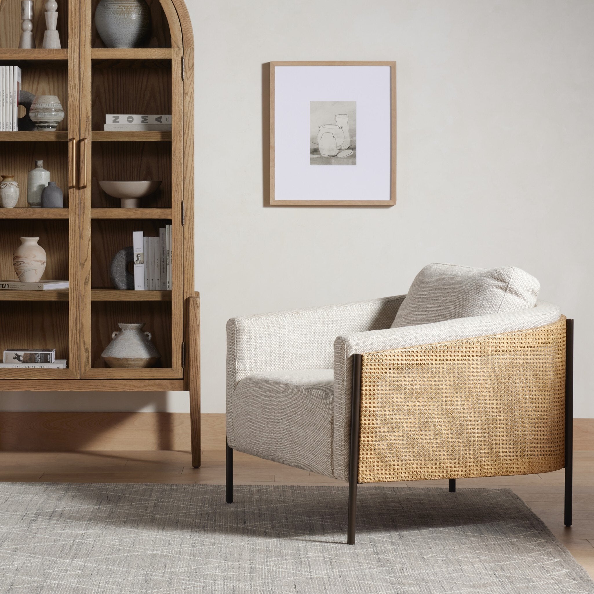 Modern armchair with wicker backrest in a living room setting