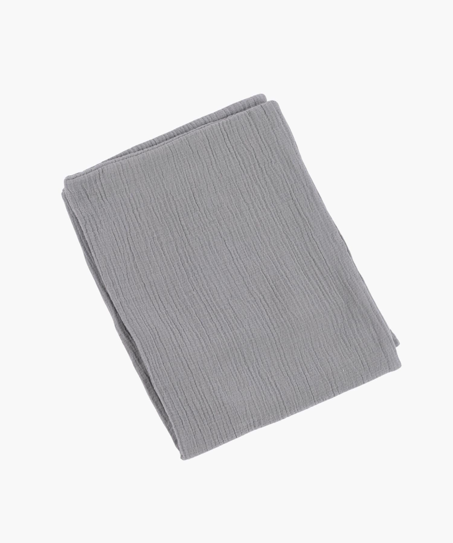 Folded cotton duvet cover in grey with a soft crinkle texture and knife edge finish, offering a minimal, airy feel.