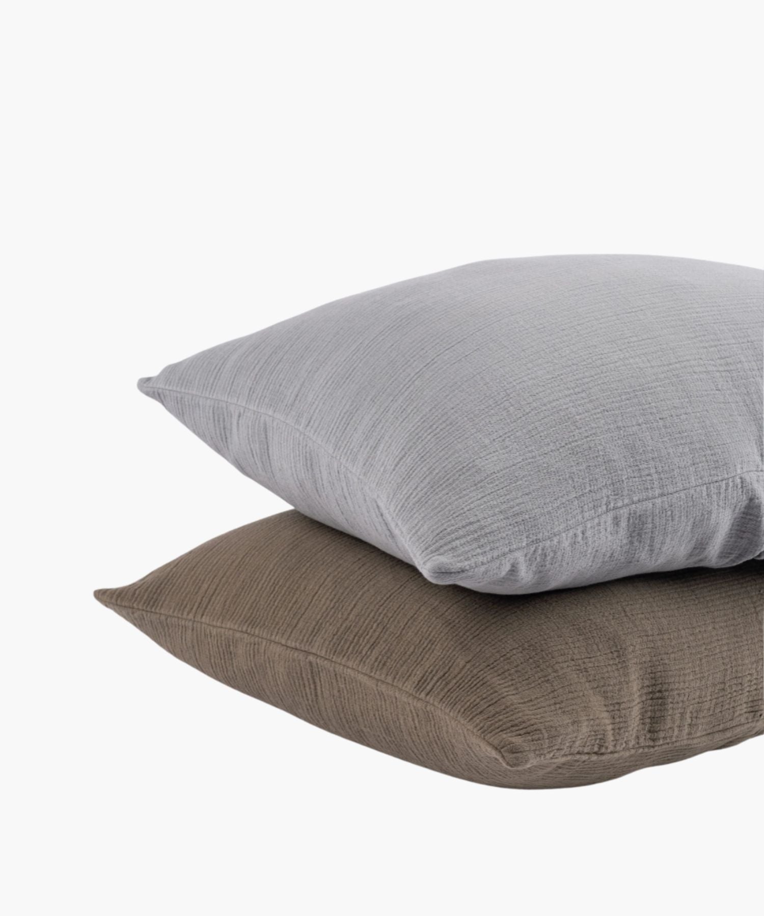 Soft taupe and gray cotton shams stacked to showcase the crinkled texture and knife edge finish in both colors.
