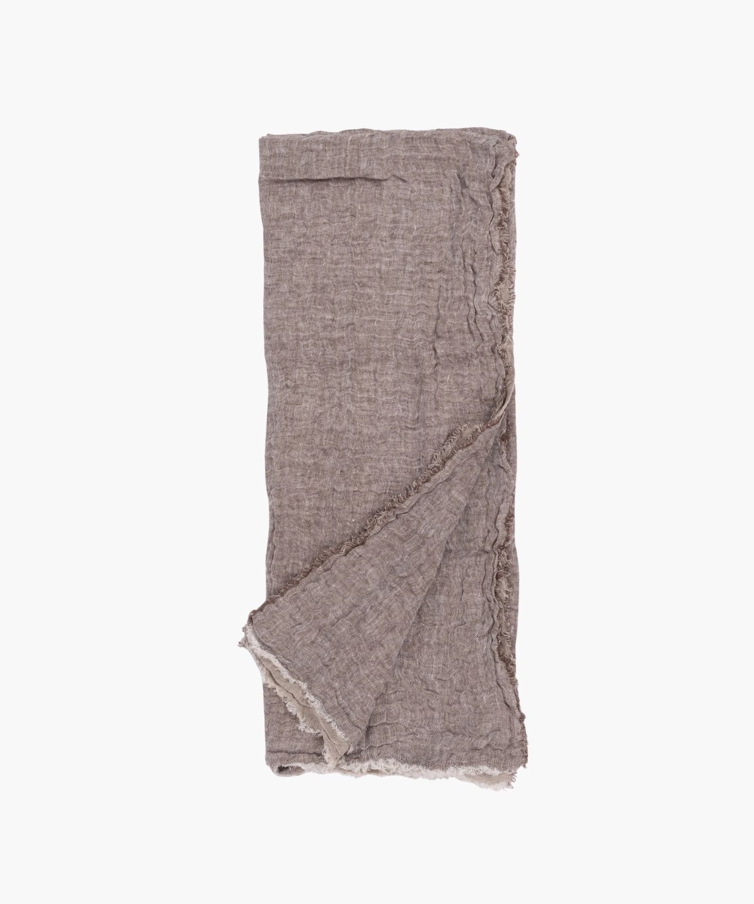 Flat lay of the Kent Super Throw in natural brown linen tone, highlighting its oversized linen gauze texture and soft fringed edges.