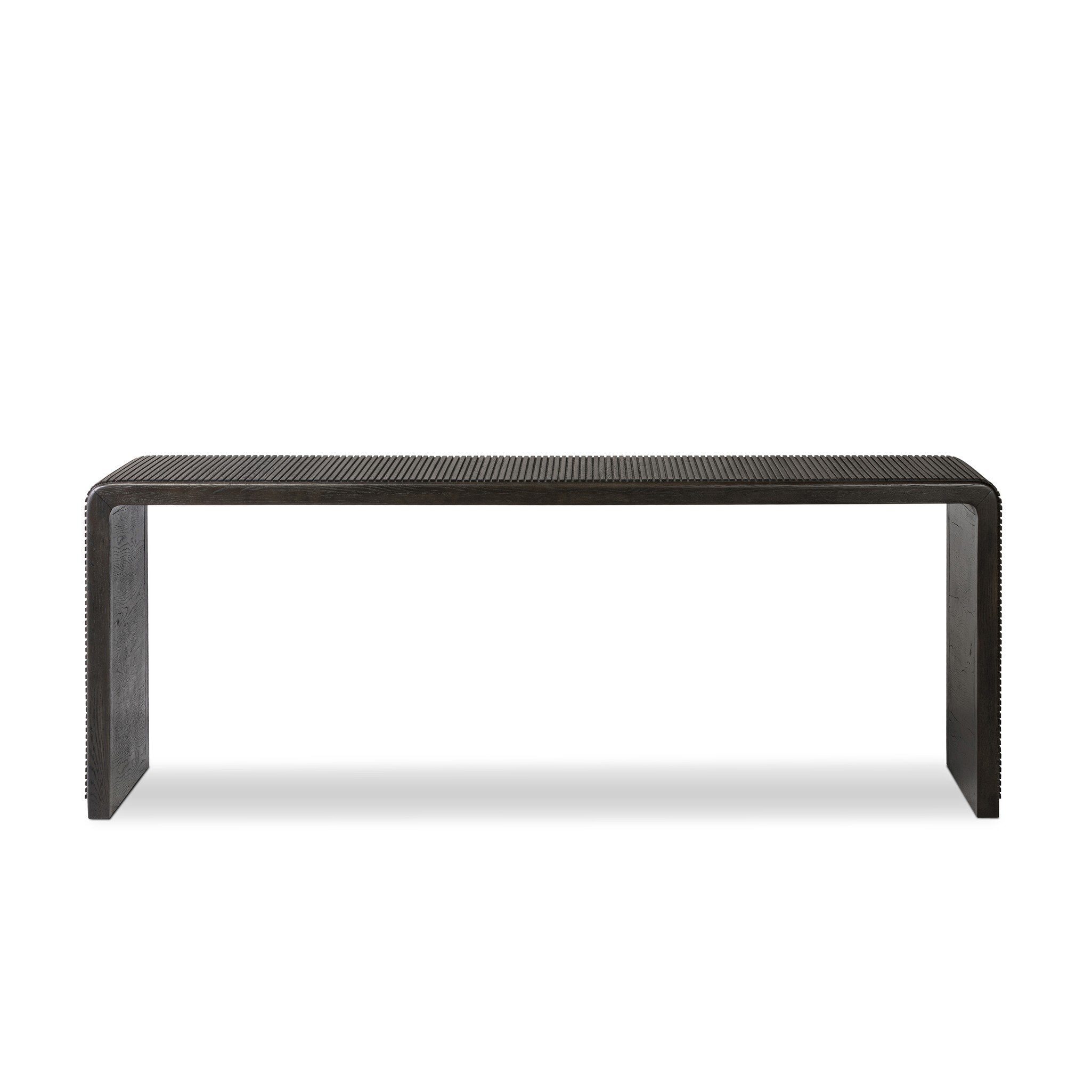 Smoked black oak console table with reeding and rounded edges on a white background.