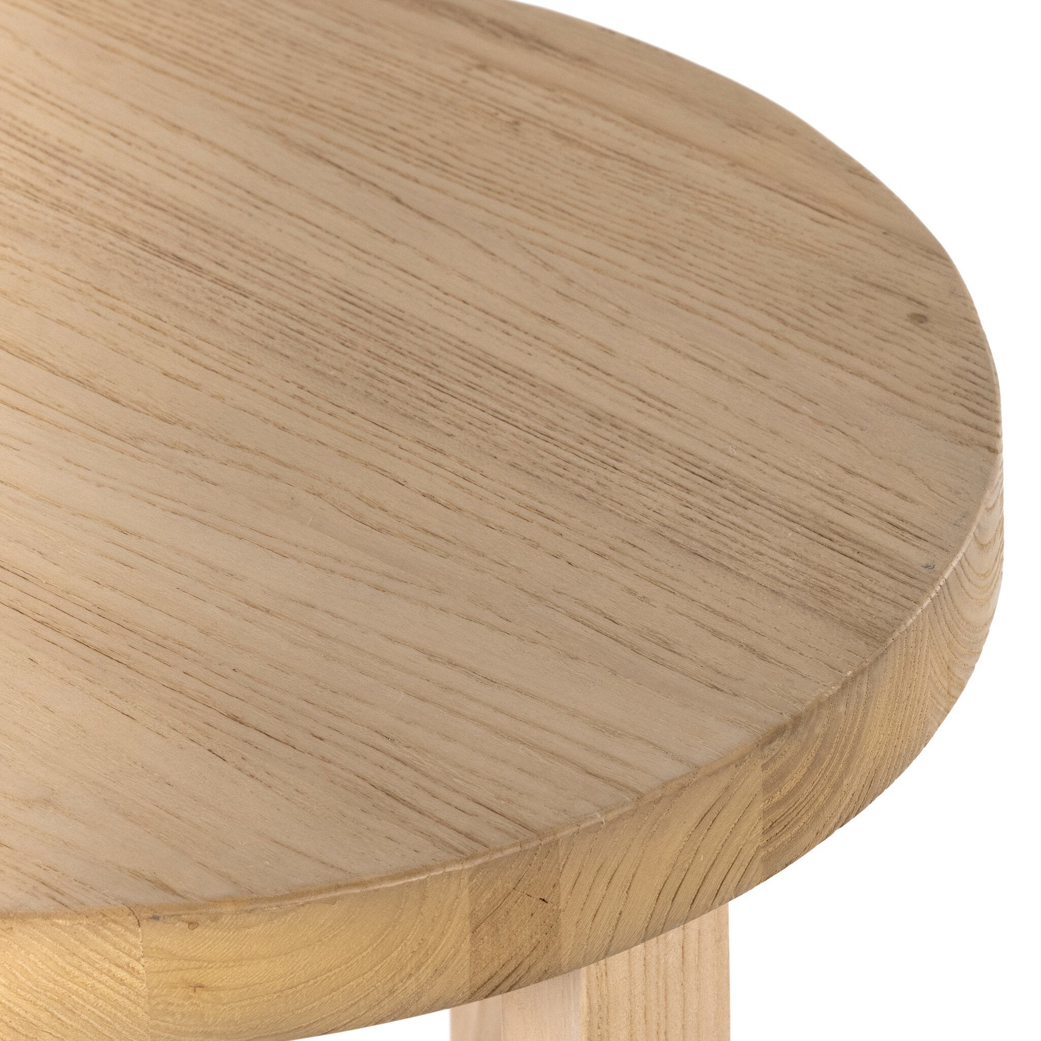 A solid natural nettlewood end table with an open cross-style base and thick, rounded table top on a white background.