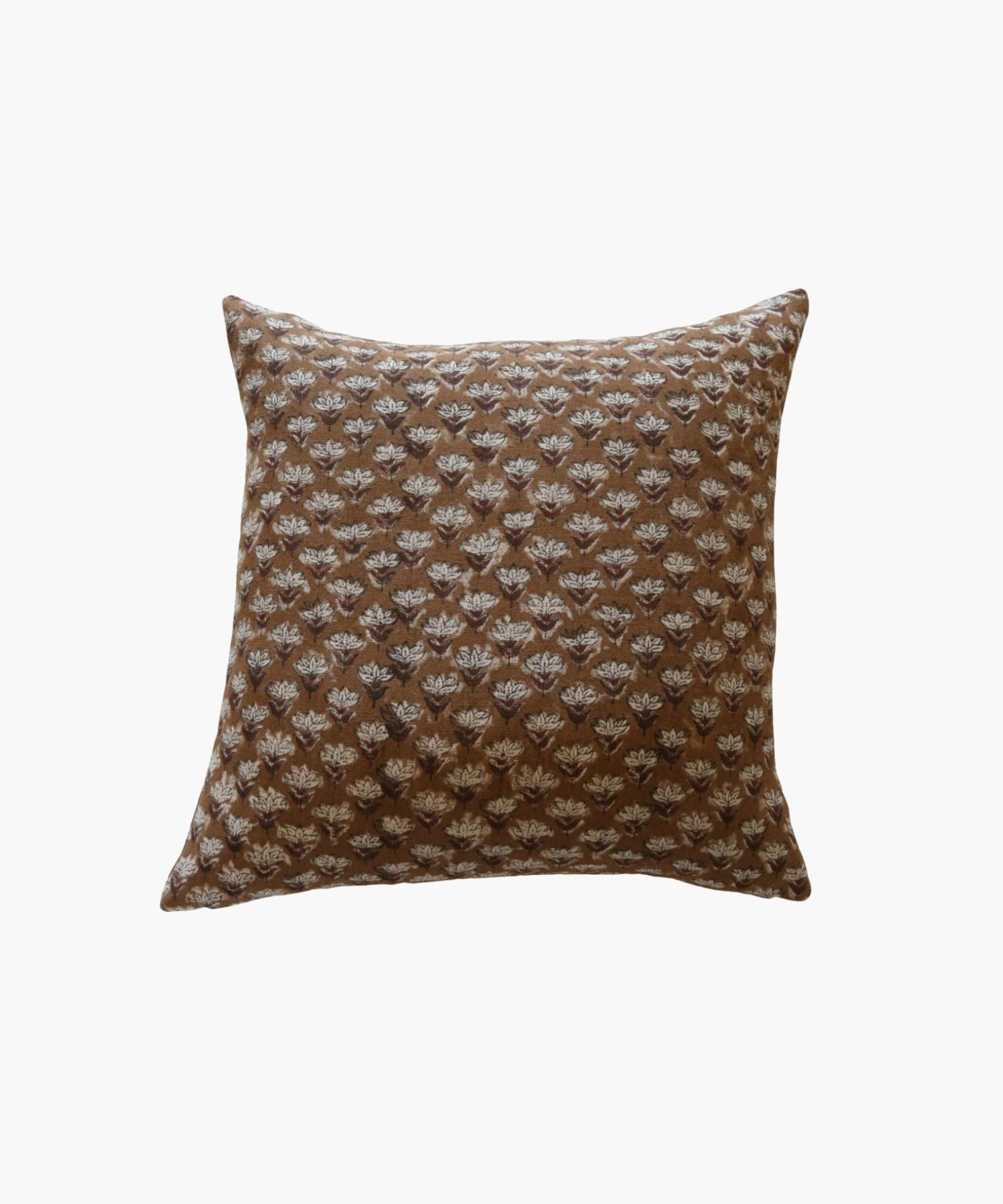 Brown pillow with a subtle floral pattern on a white background