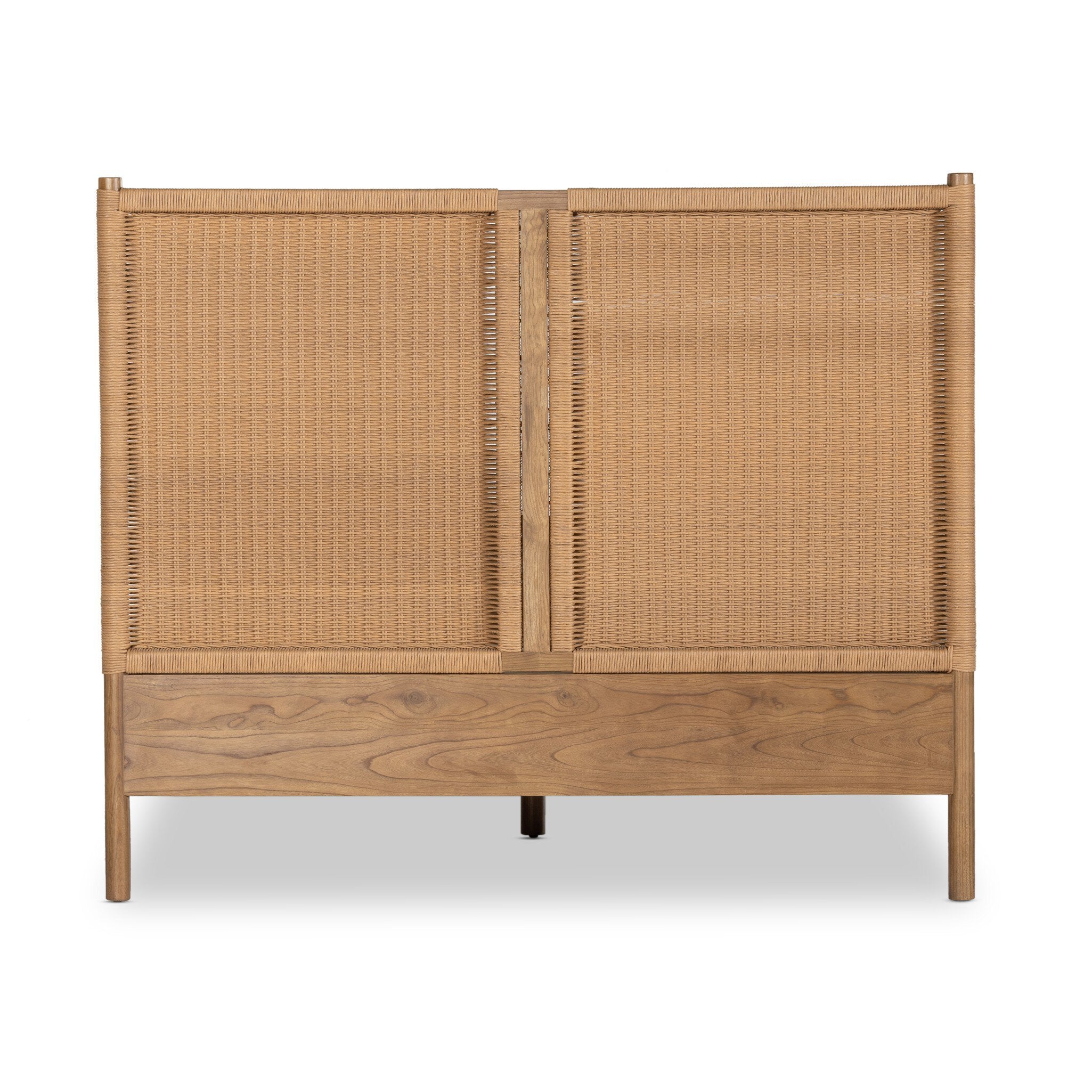 The back of a wicker bed with white bedding on a white background.