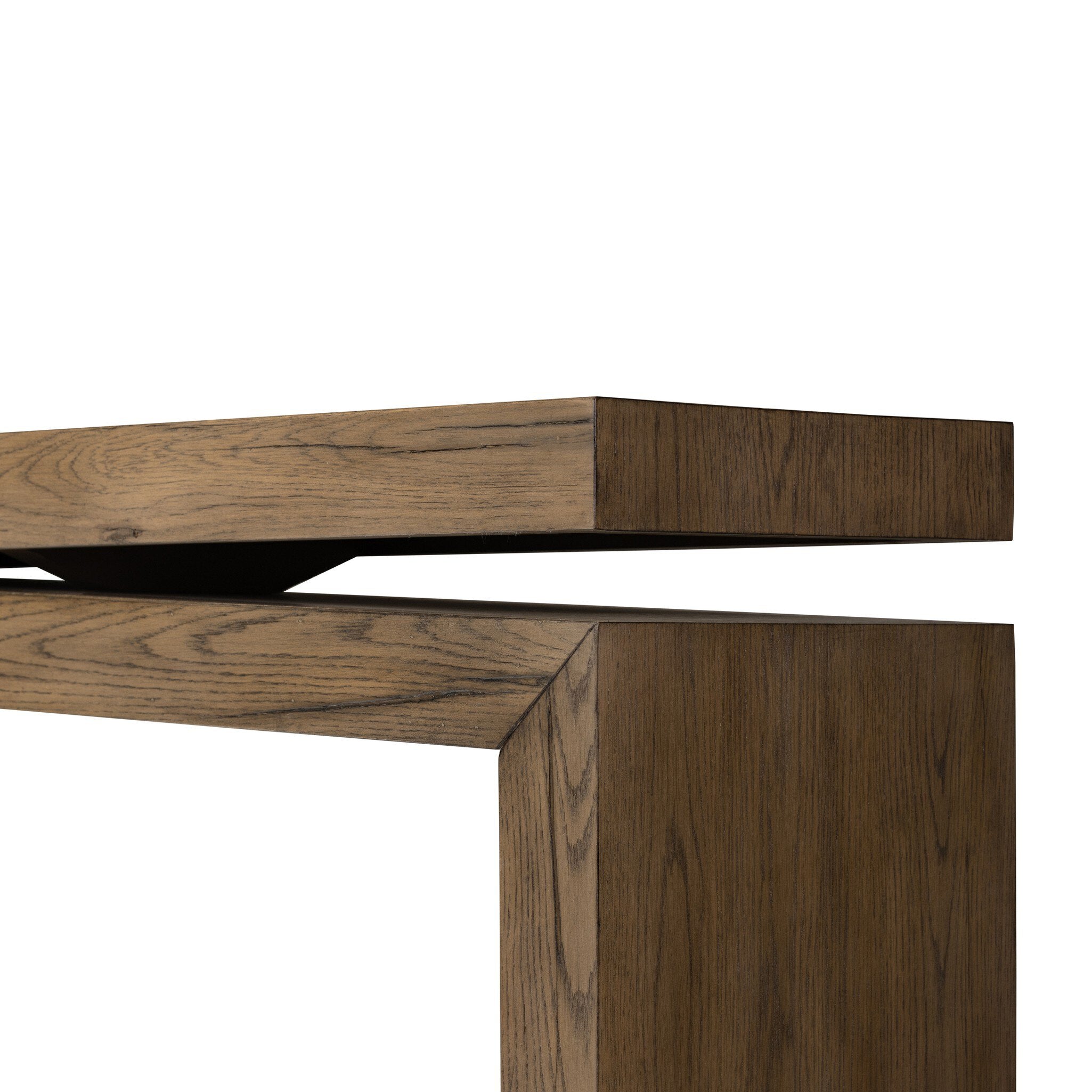 Close up of a wooden console table with a curved design on a white background.