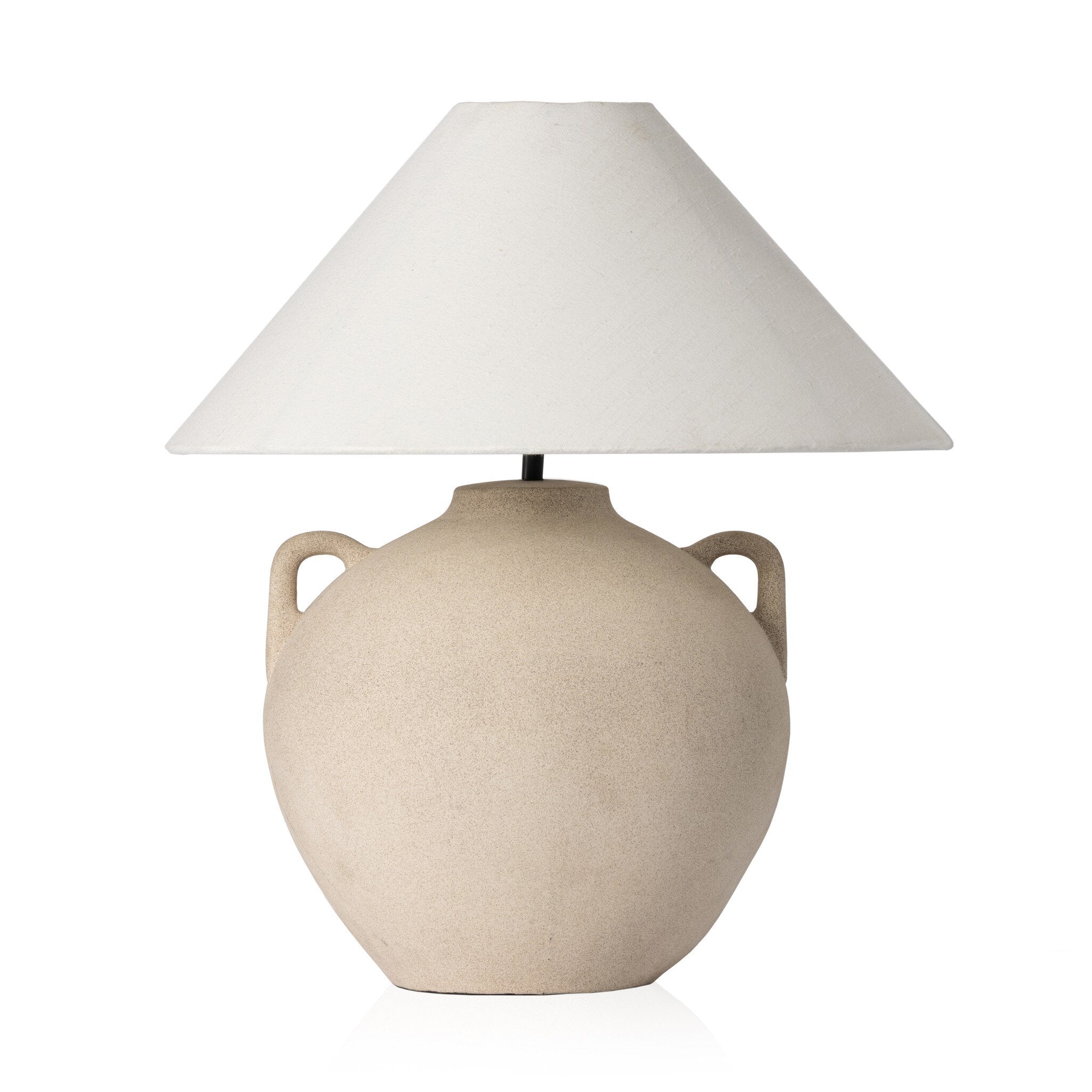 Beige ceramic table lamp with an ivory lampshade on a white background.