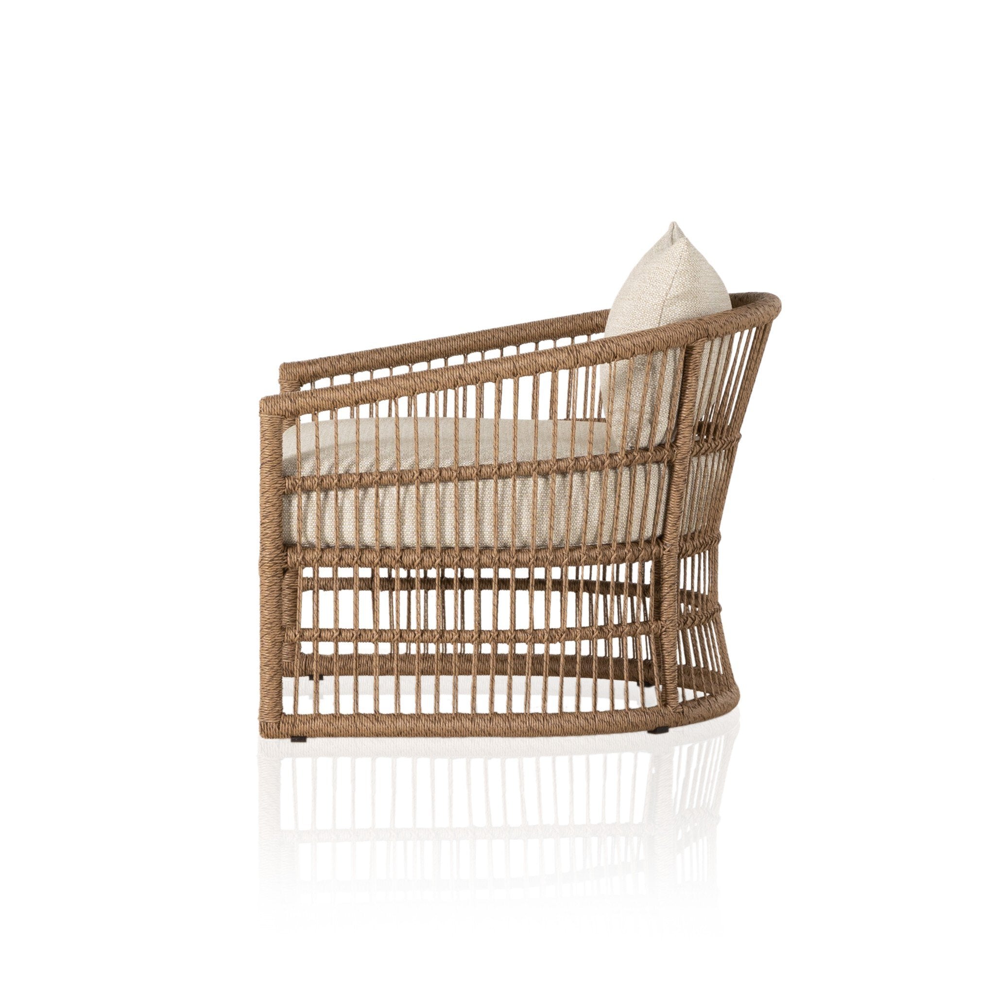 Side profile of a cottage inspired outdoor chair with wrapping and texture along with beige colored upholstered cushions on a white background.