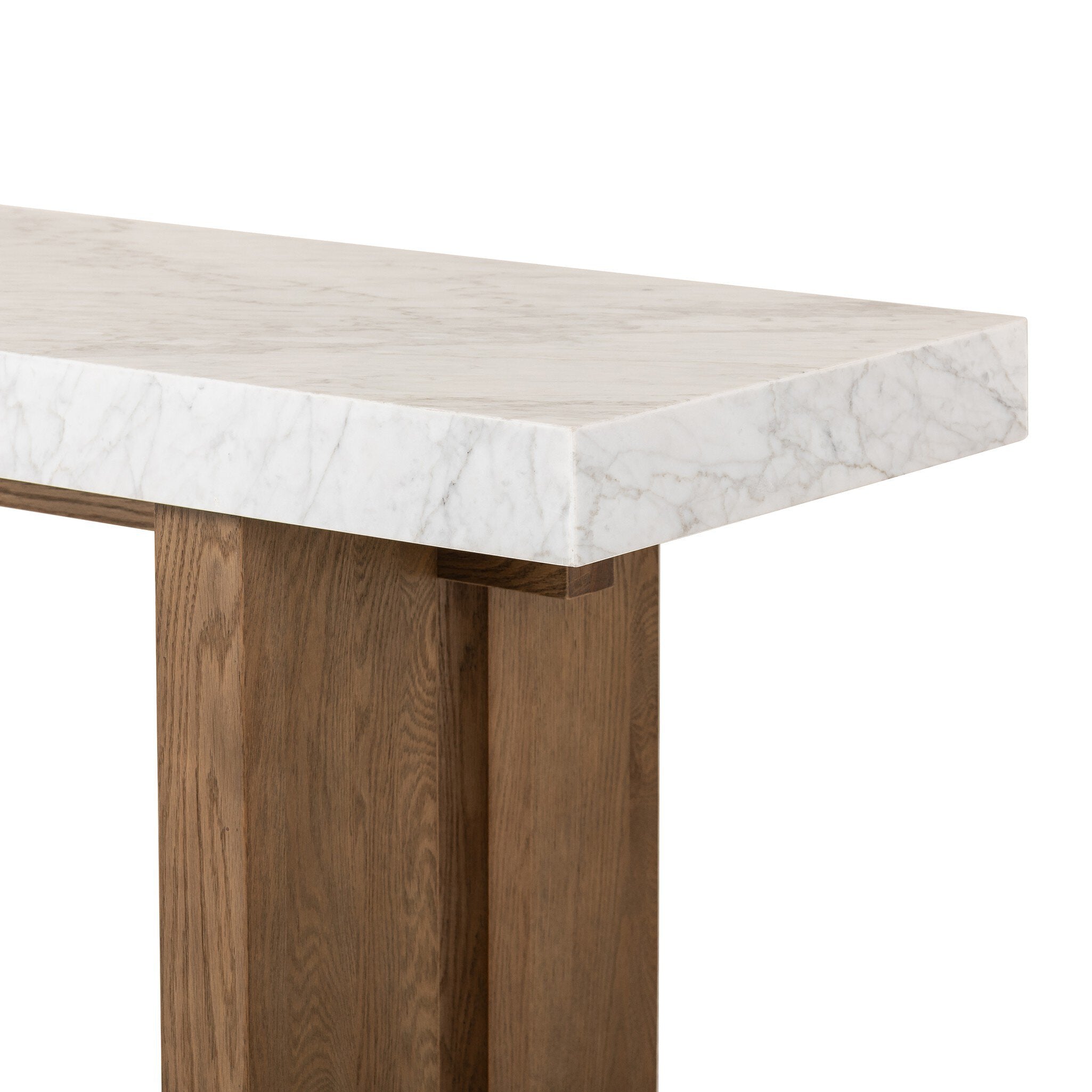 Close up of a console table with marble top and wooden legs on a white background.