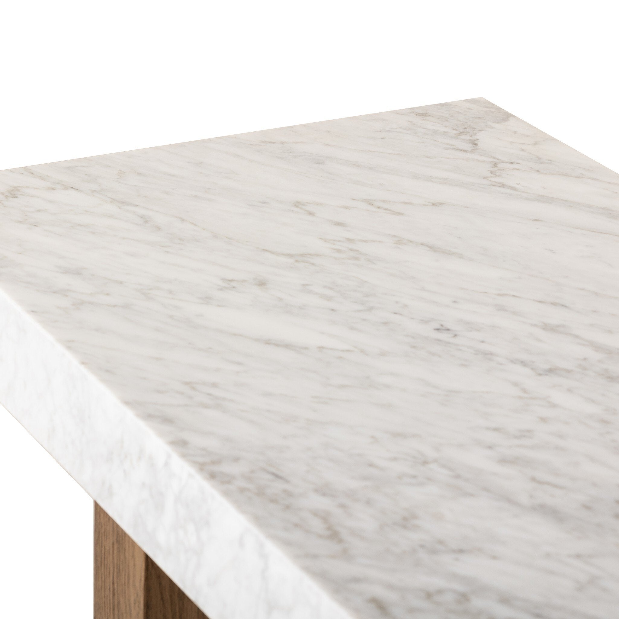 Close up of a console table with marble top and wooden legs on a white background.