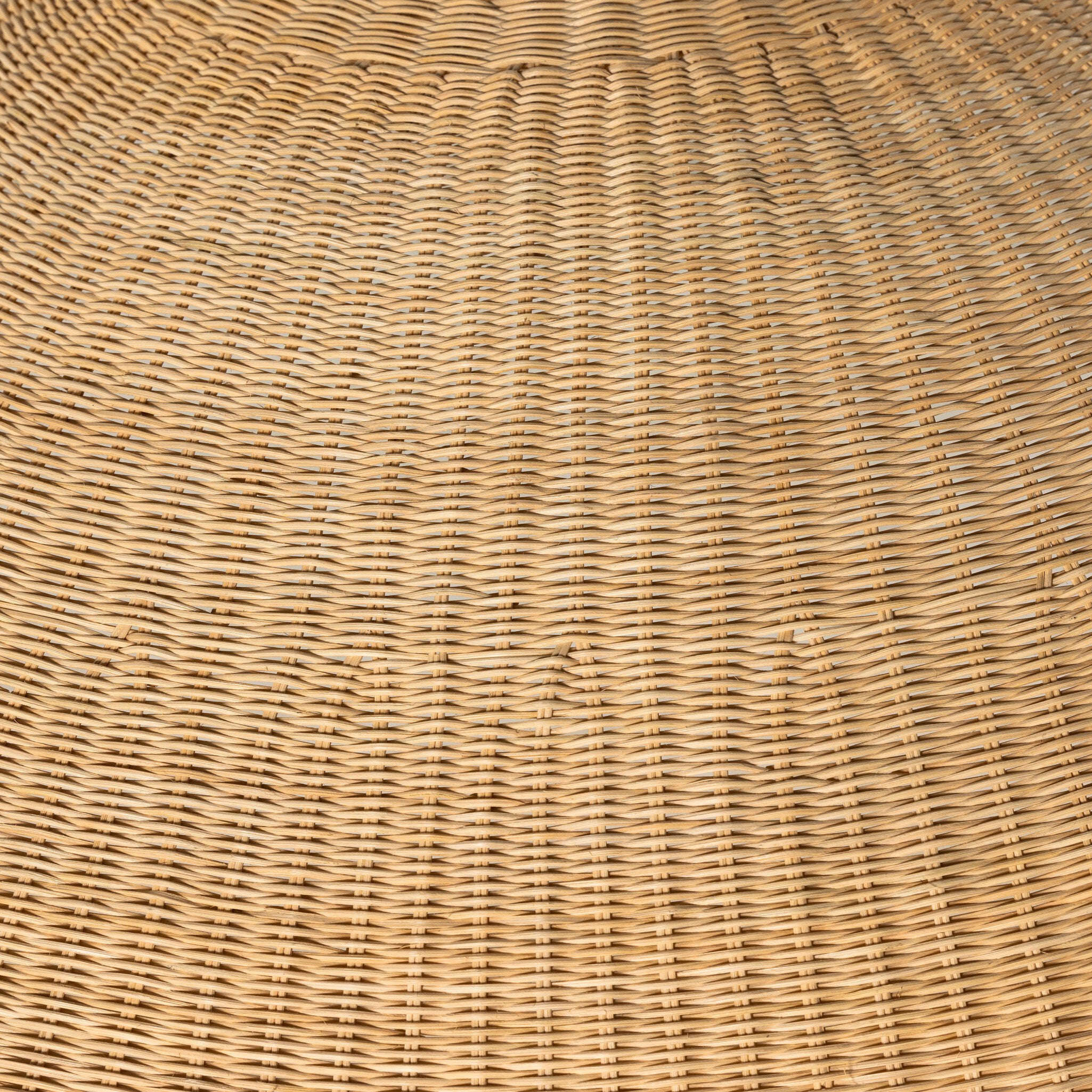 Close-up of a woven wicker pendant light highlighting its texture.