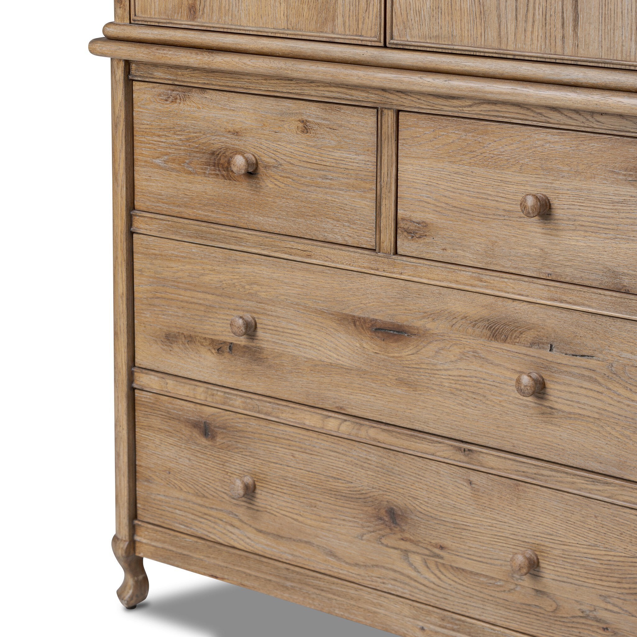 A wooden armoire with two doors and four drawers on a white background.