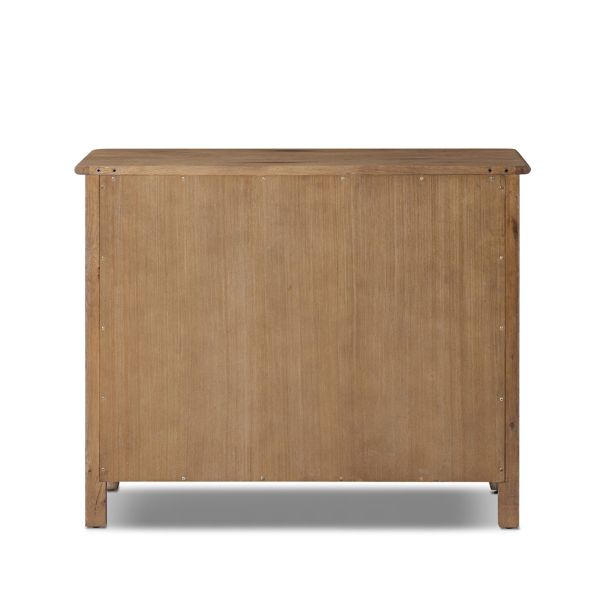 The back of a wooden dresser with four drawers on a white background.