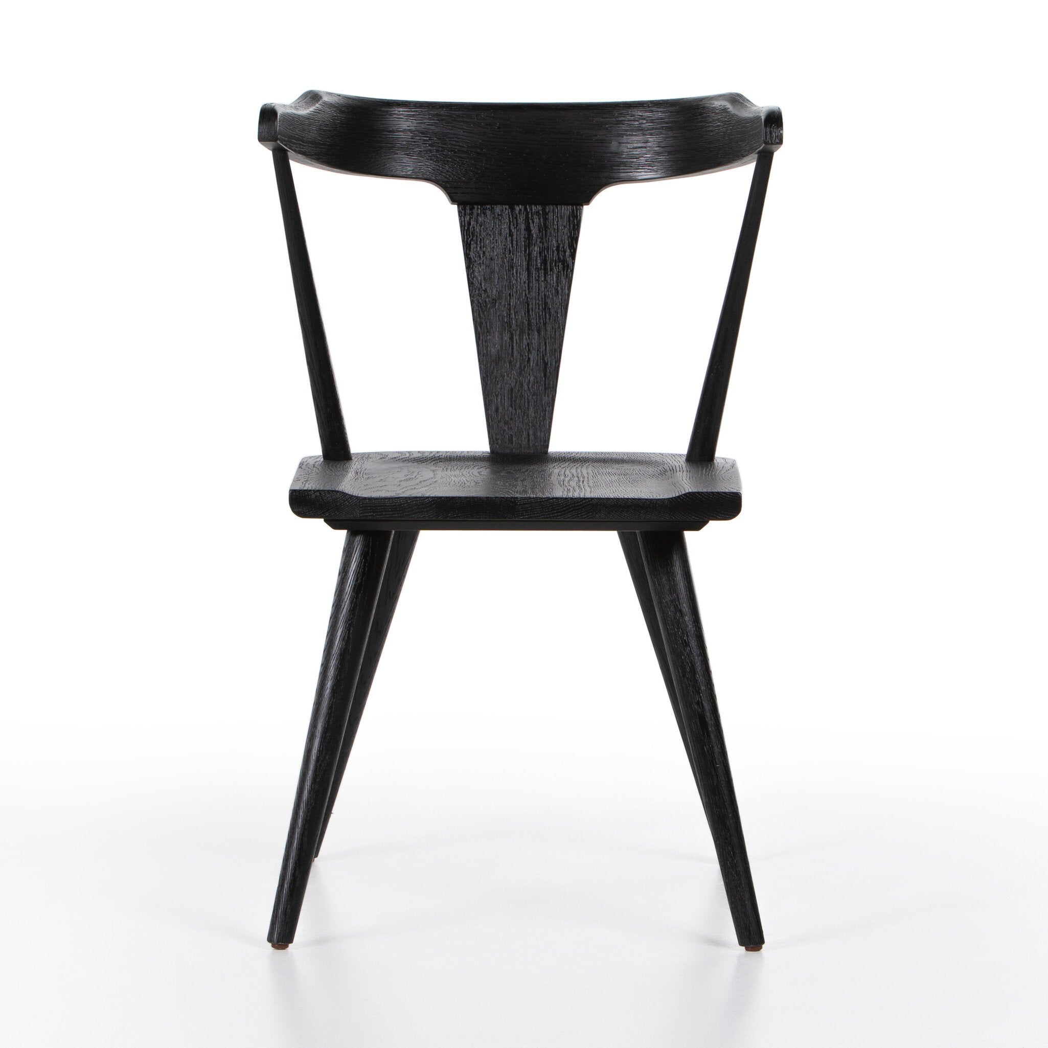 Black wooden dining chair on a white background.