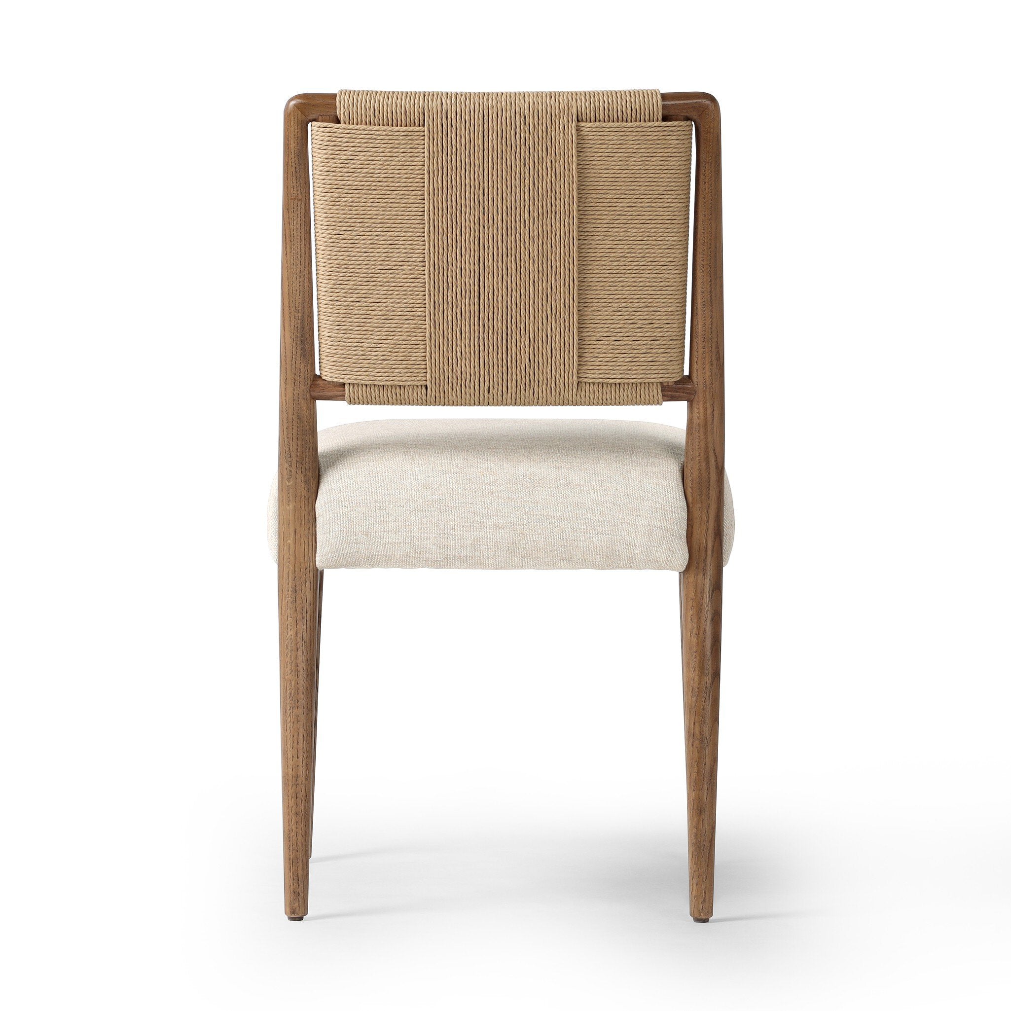 The back of a dining chair with woven backrest and beige cushion on a white background.