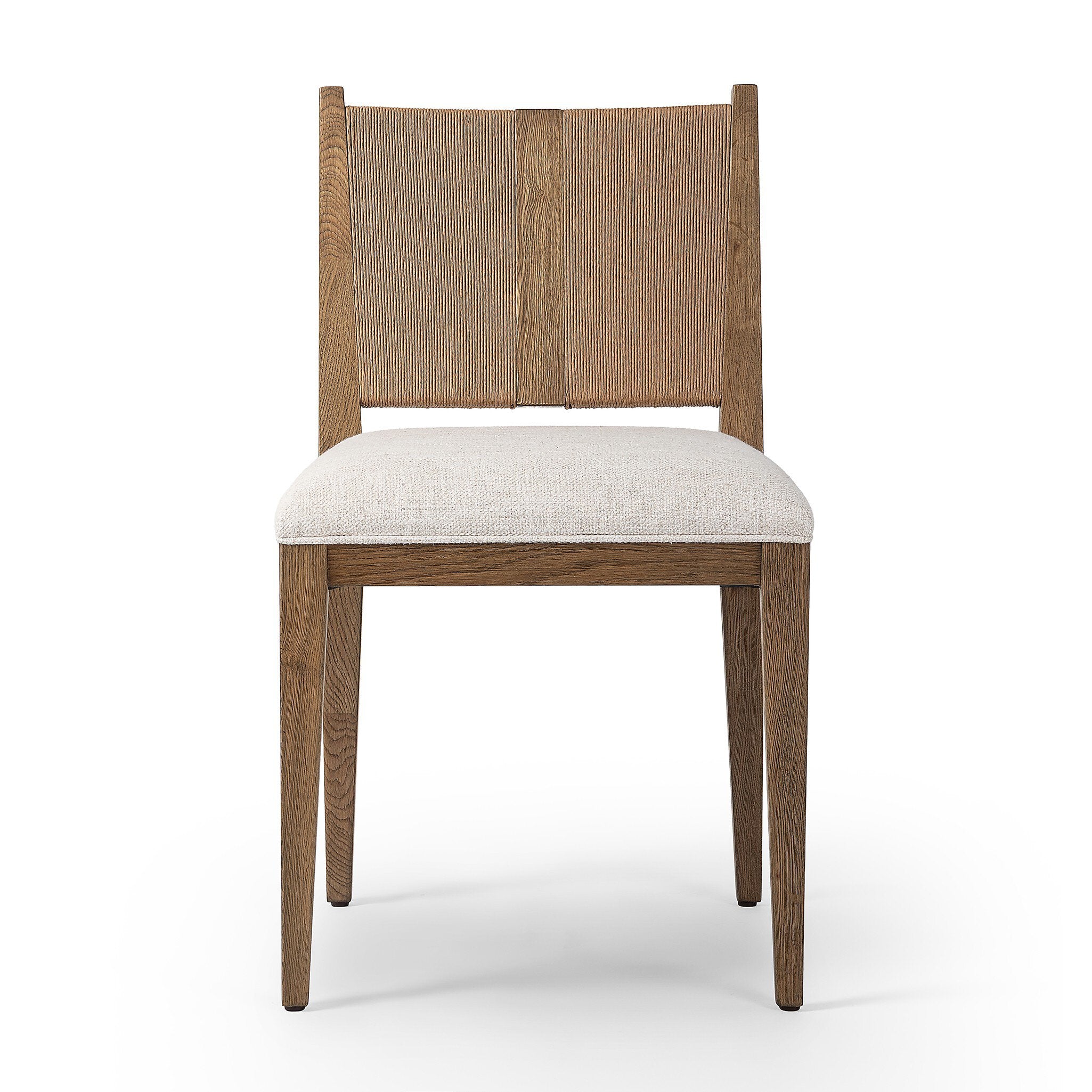 Wooden dining chair with a woven backrest and white cushion on a white background
