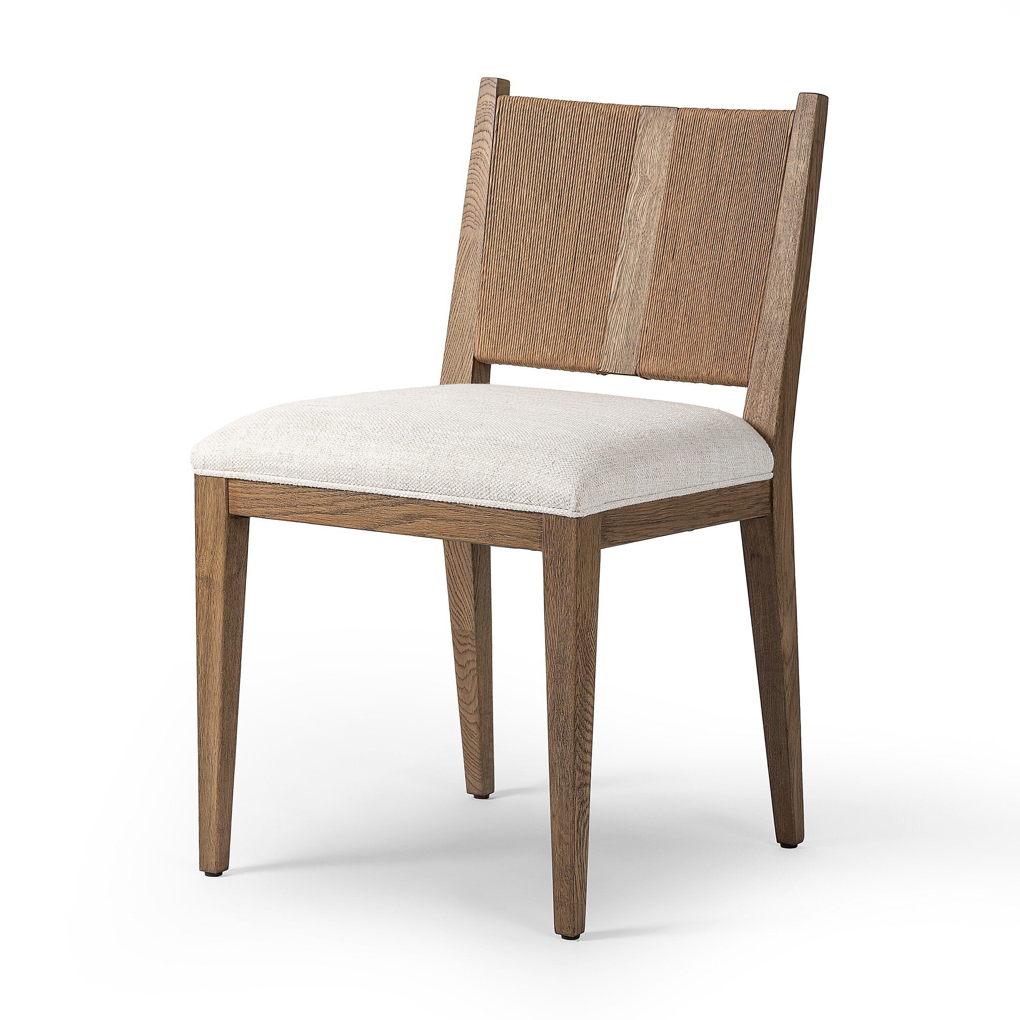 Wooden dining chair with a woven backrest and white cushion on a white background