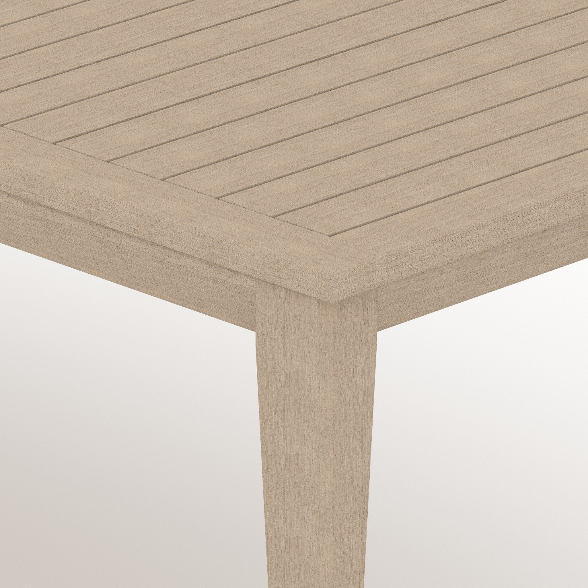 Close-up of a wooden table with a light brown finish on a white background