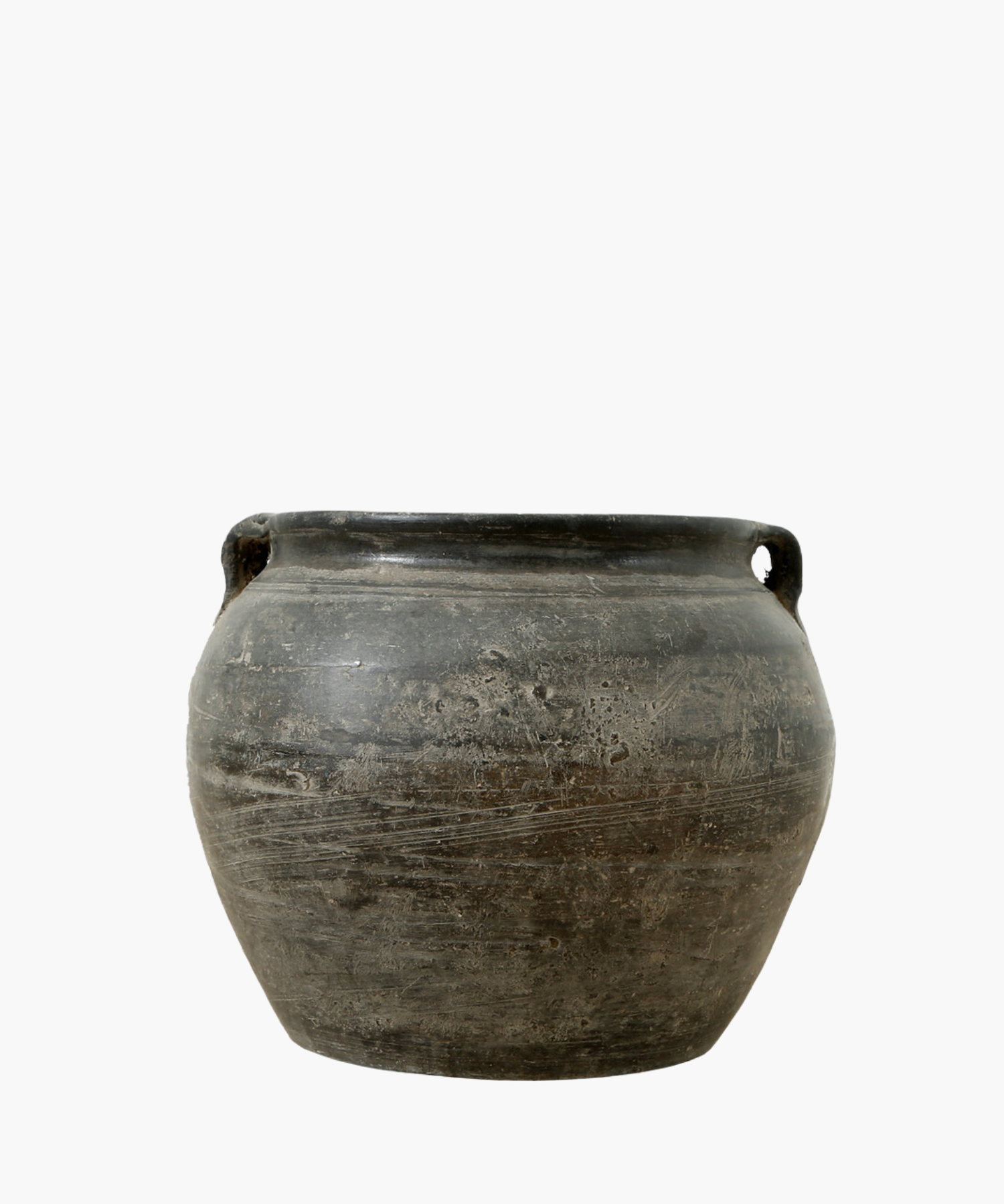 A rustic, vintage inspired round ceramic pot with a dark finish pot and small handles on each side. It conveys a sense of antiquity and simplicity.