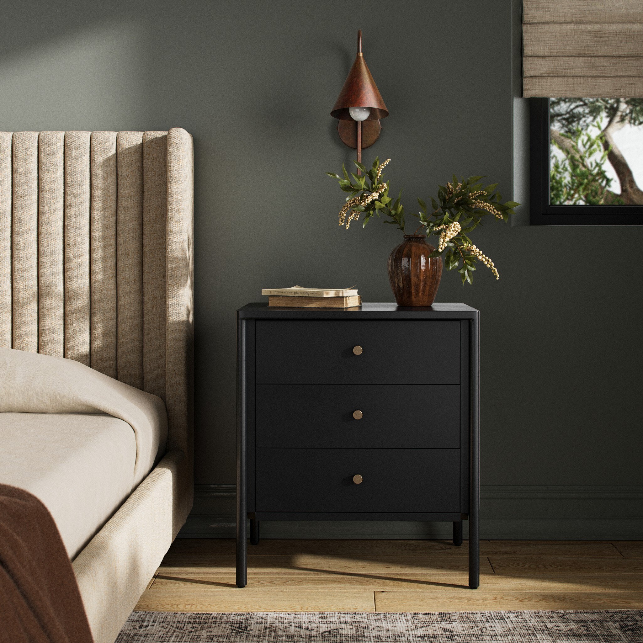 Black dresser with three drawers on a white background.