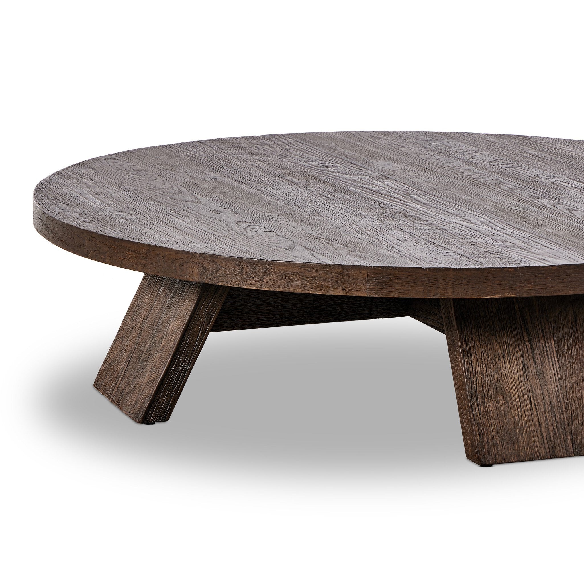 Round wooden coffee table on a white background.