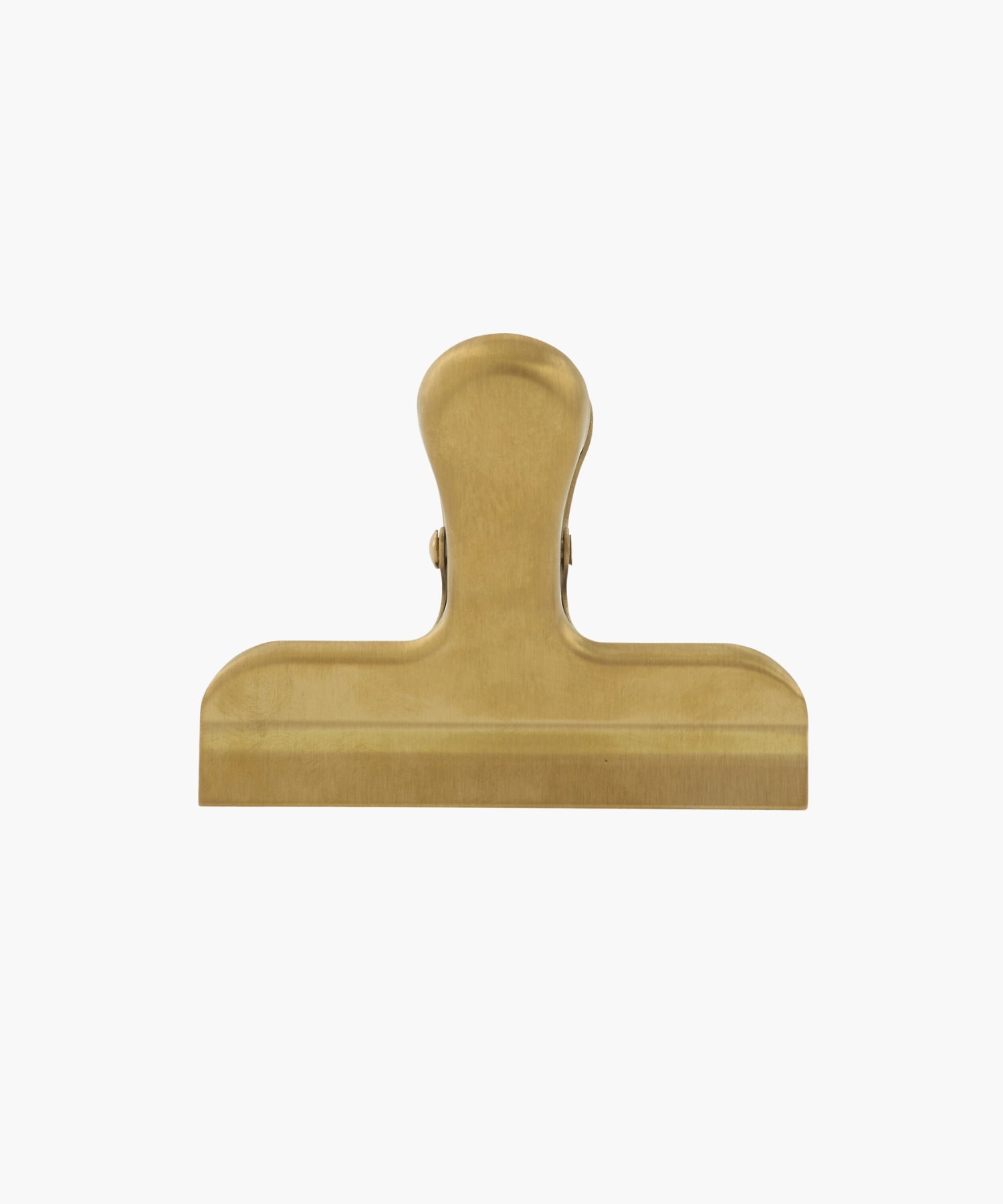 A gold-colored metal binder clip. The clip is large, with a smooth finish, conveying a utilitarian feel.