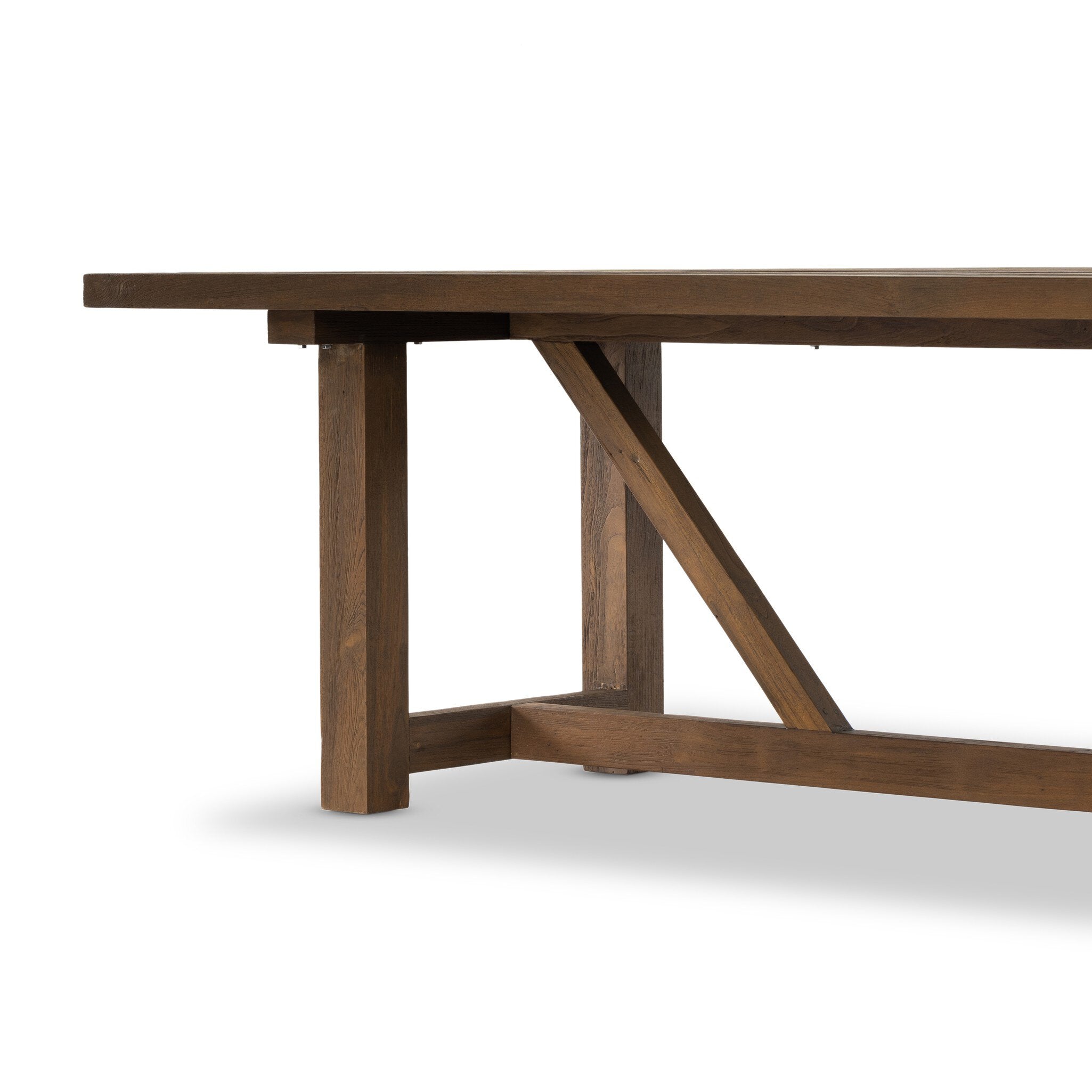 Trestle-style dining table made from reclaimed teak on a white background.