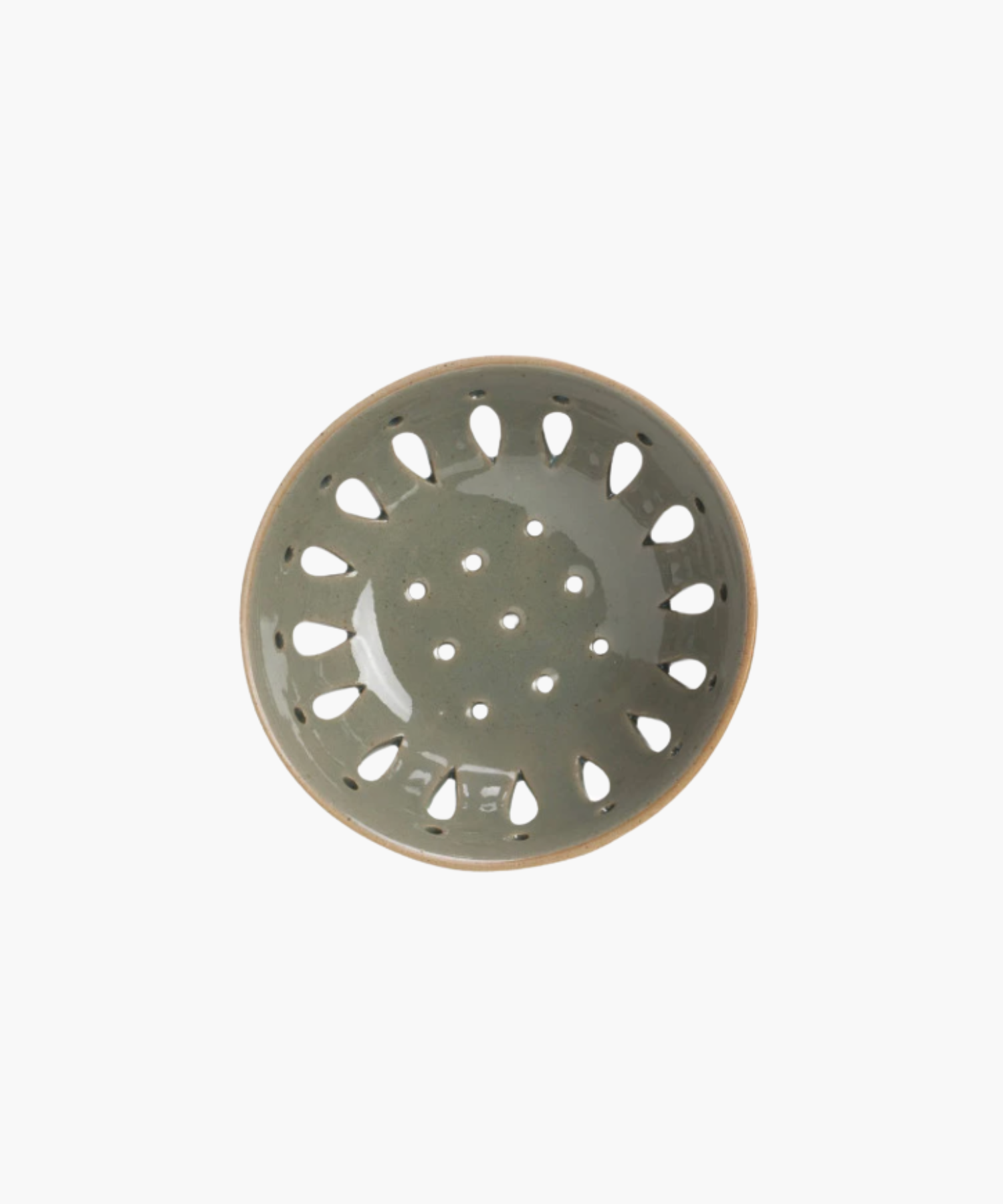 A grey blue ceramic colander with a light brown rim, featuring round holes and teardrop-shaped cutouts, standing out against a plain white background.