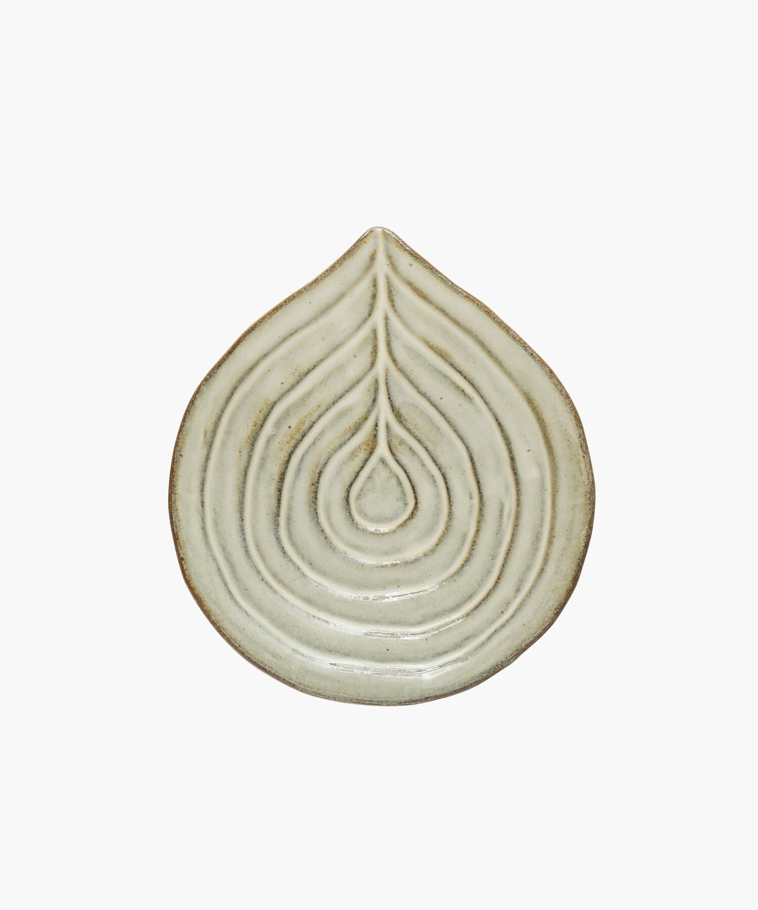 Embossed stoneware dish or spoon rest with reactive glaze.