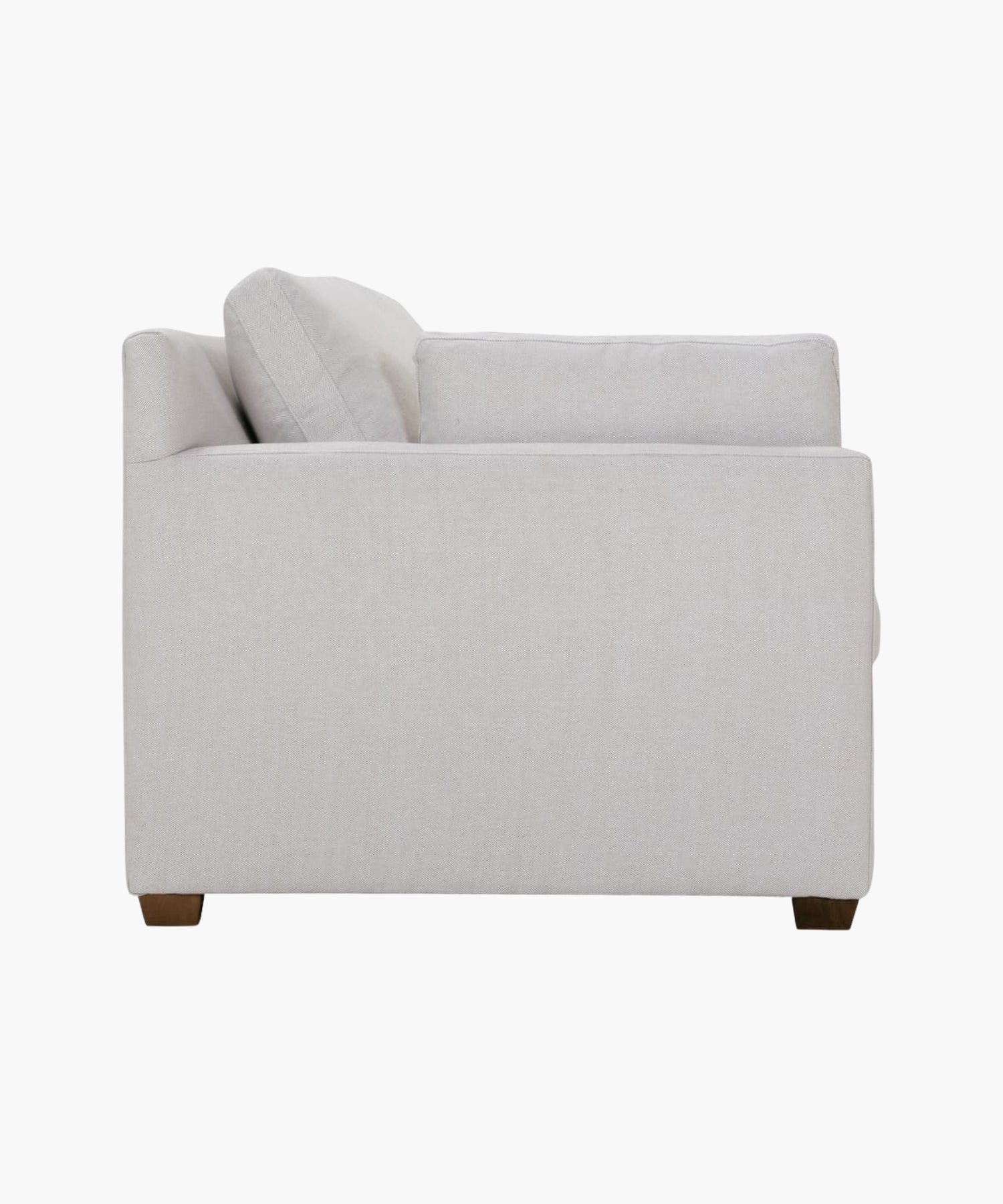 Side profile of a gray sofa on a white background.