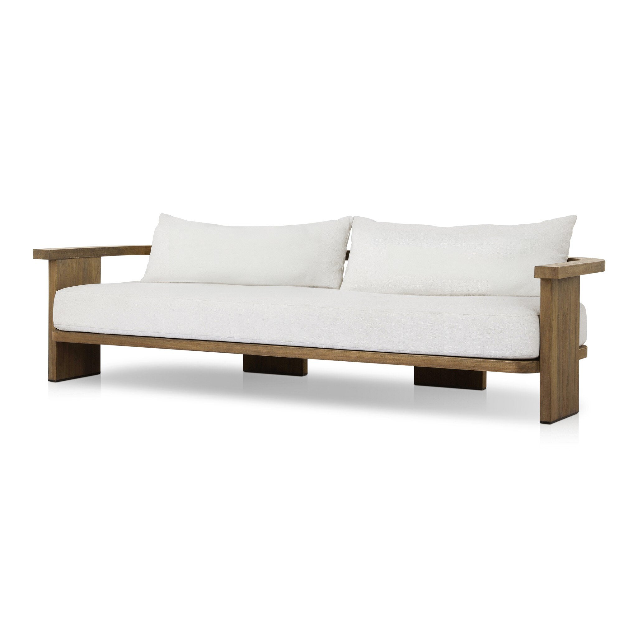 Outdoor sofa with curved wooden frame out of teak and white linen cushions on a white background.
