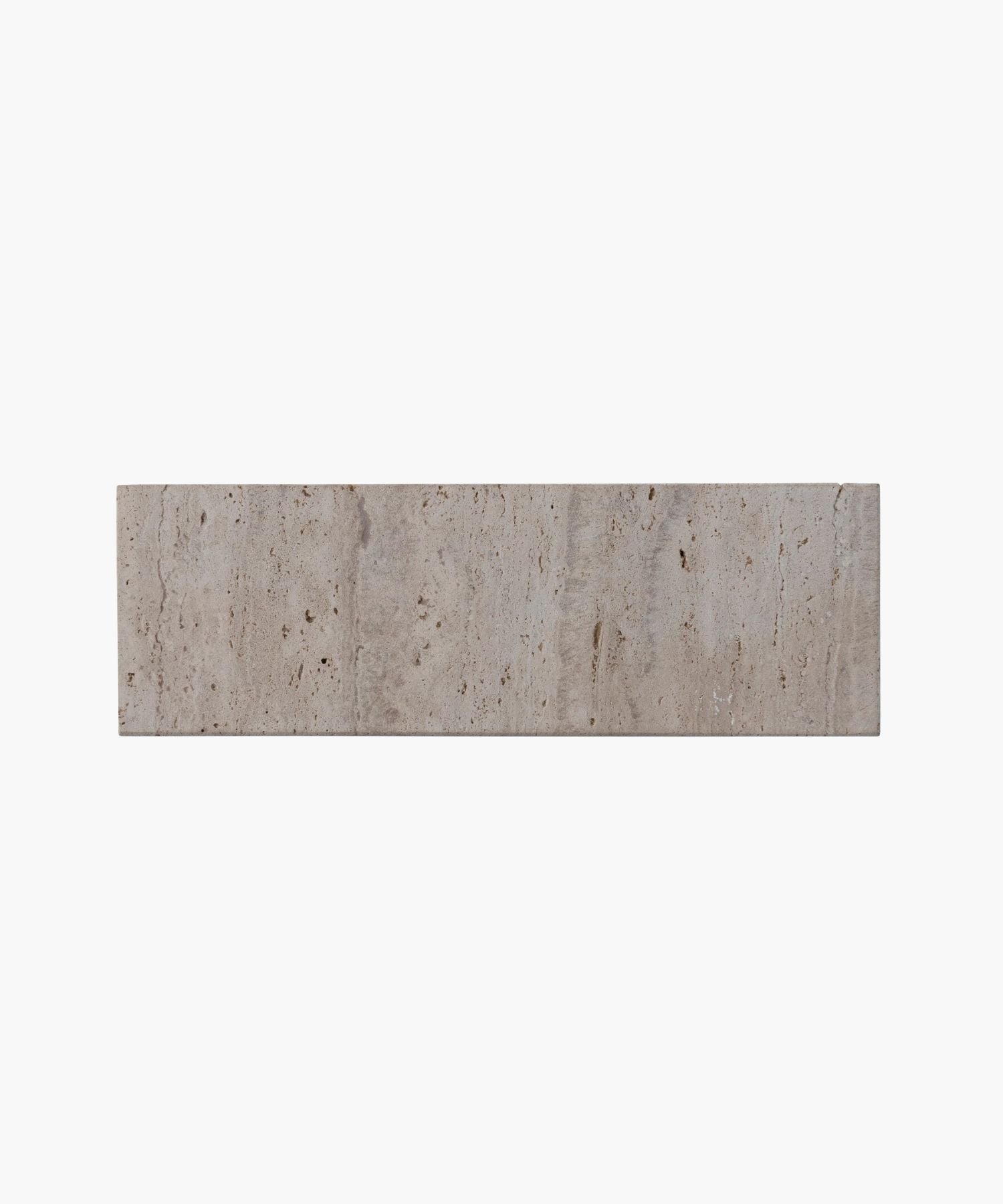 An overhead picture of a rectangular travertine tray highlighting its with a smooth, beige surface. The minimalist design gives a clean, modern aesthetic.