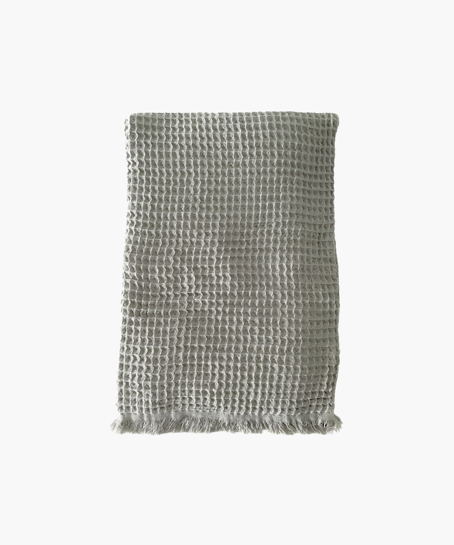 Olive waffle-textured throw blanket with fringed edges, laid flat. The soft material conveys a cozy, inviting feel. Suitable for any living room or bedroom.