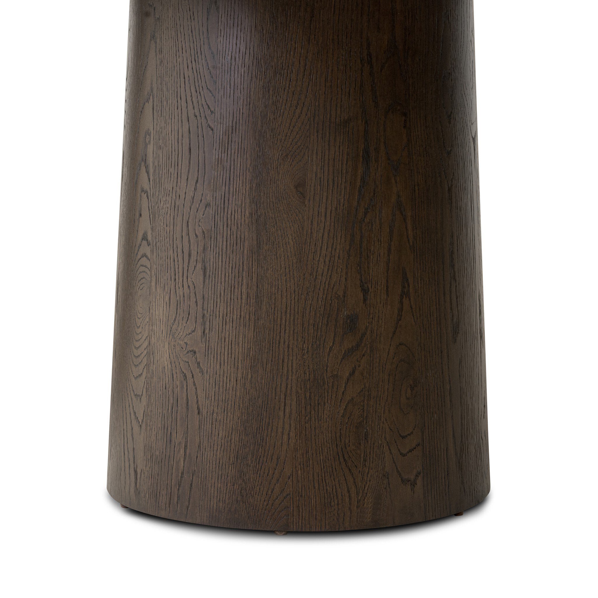 Close up of a wooden dining table with two cylindrical legs on a white background.