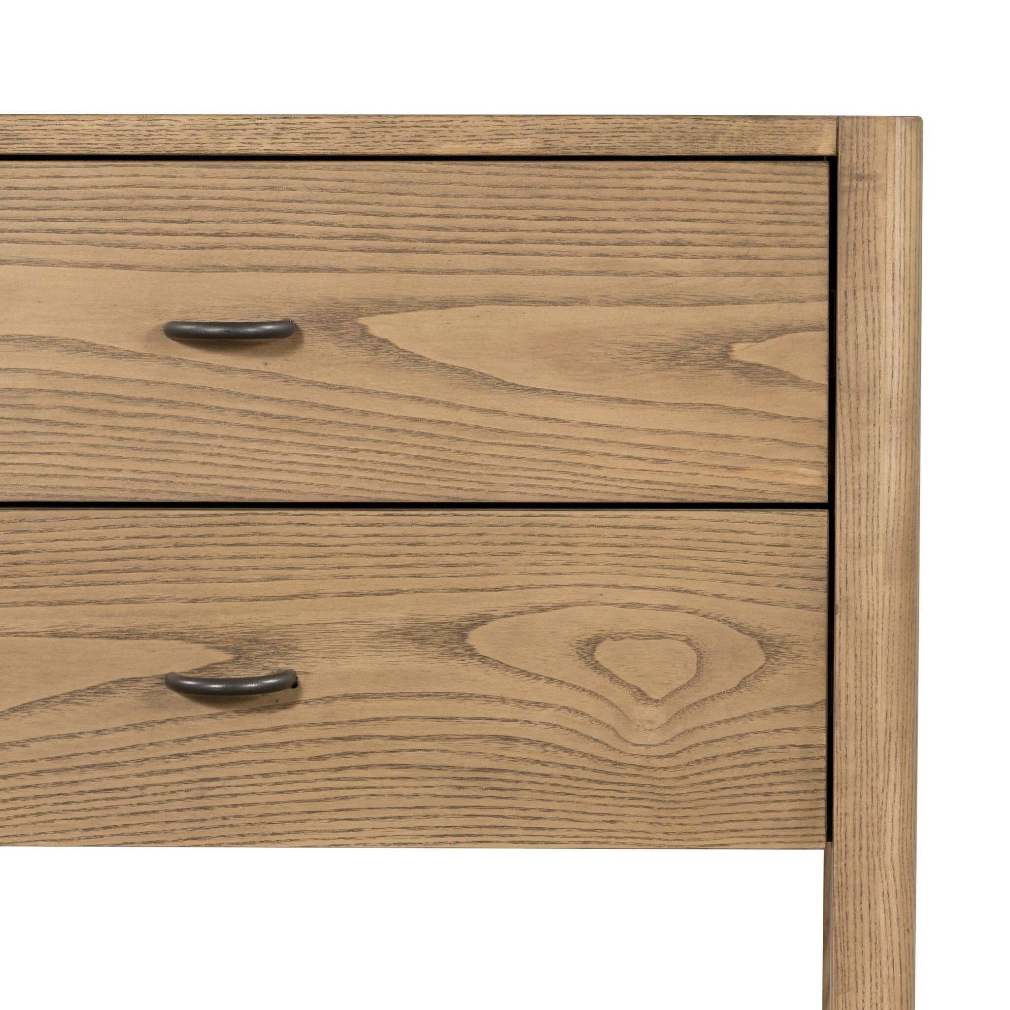 Close up of a wooden nightstand with two drawers and a woven shelf on a white background.